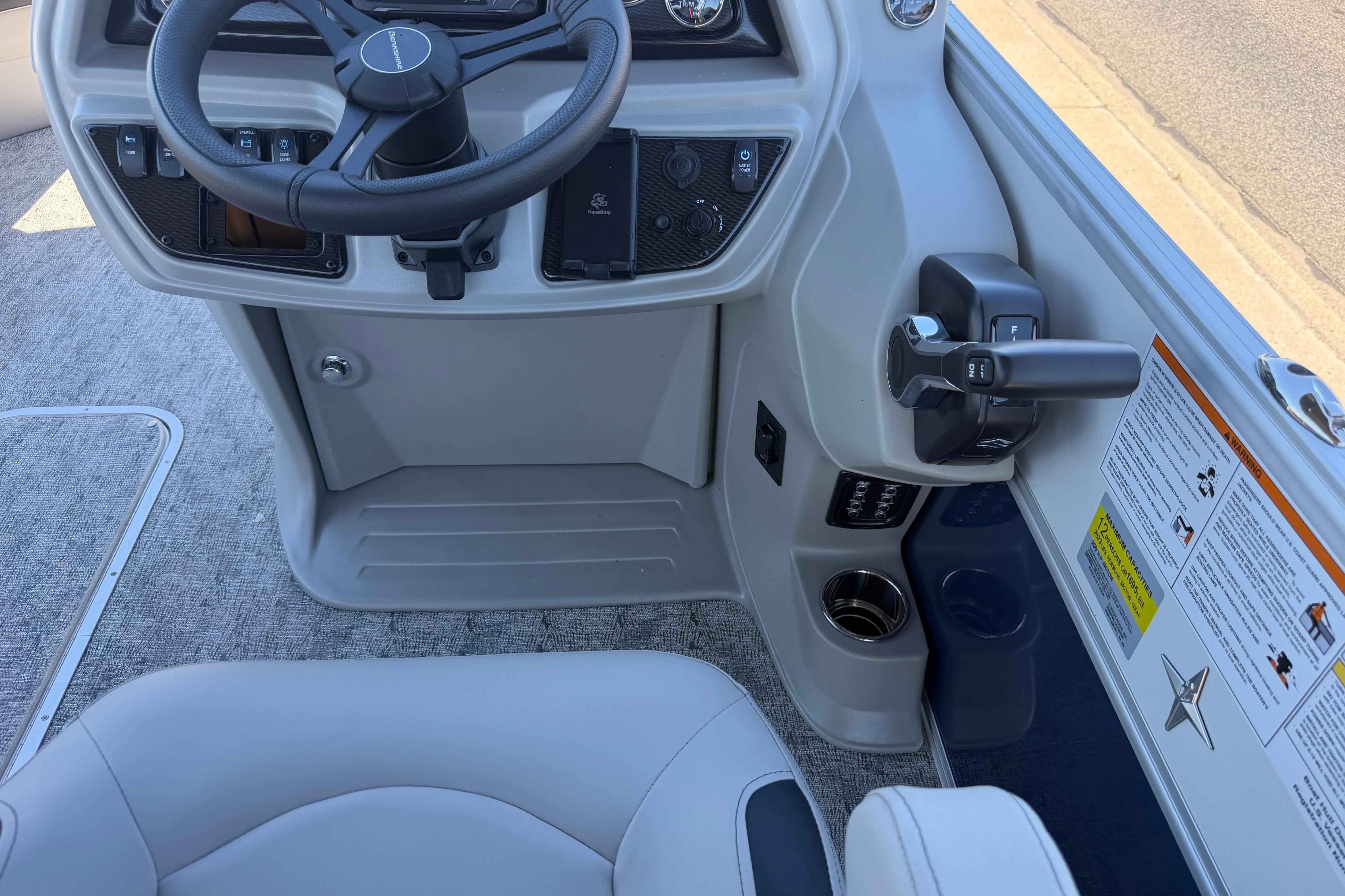 Interior view of 2026 Berkshire LE 24' Ultra Lounger boat's steering console and controls.