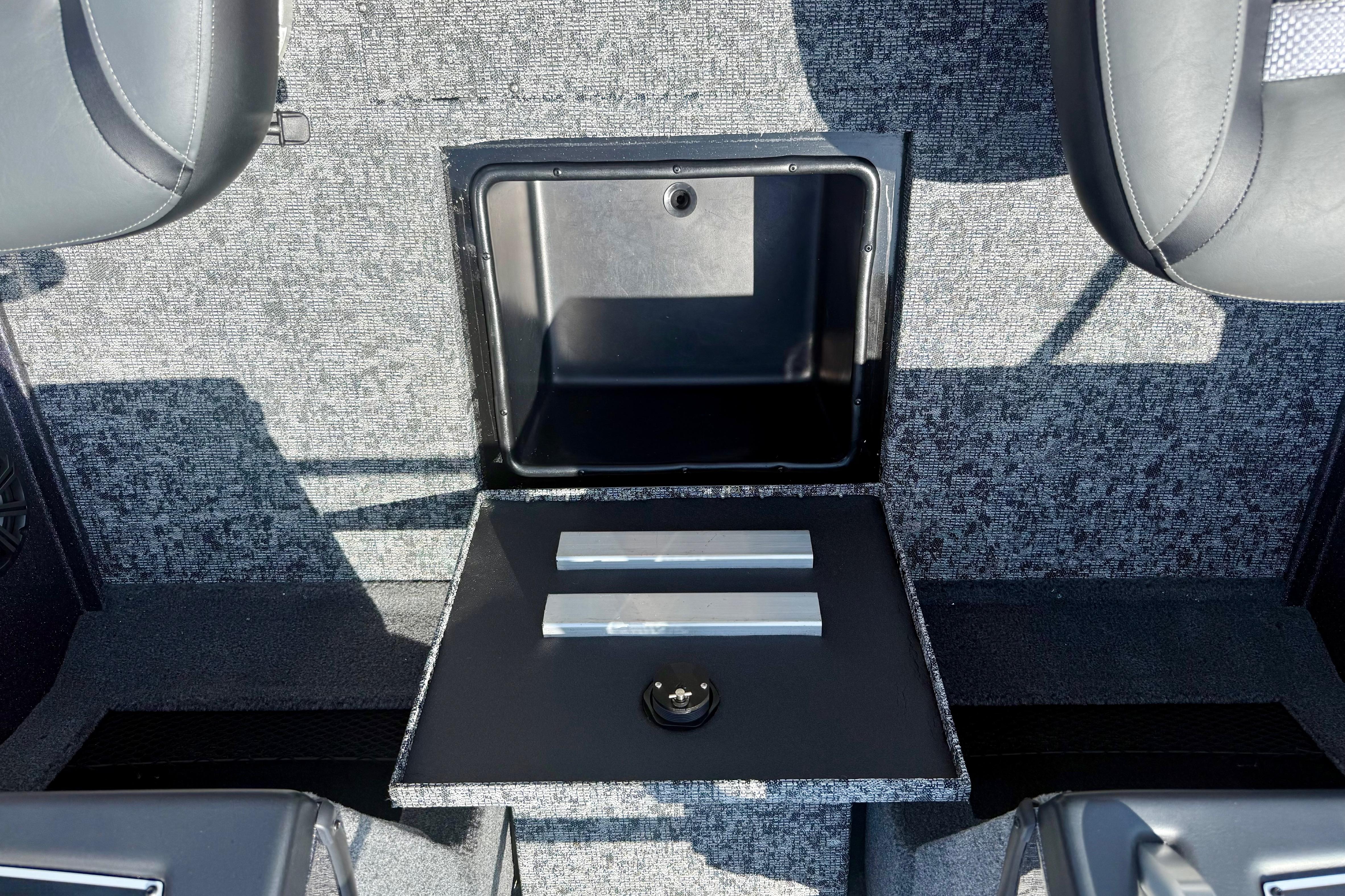2026 Ranger VX1788 WT boat storage compartment with open lid, showcasing interior space.