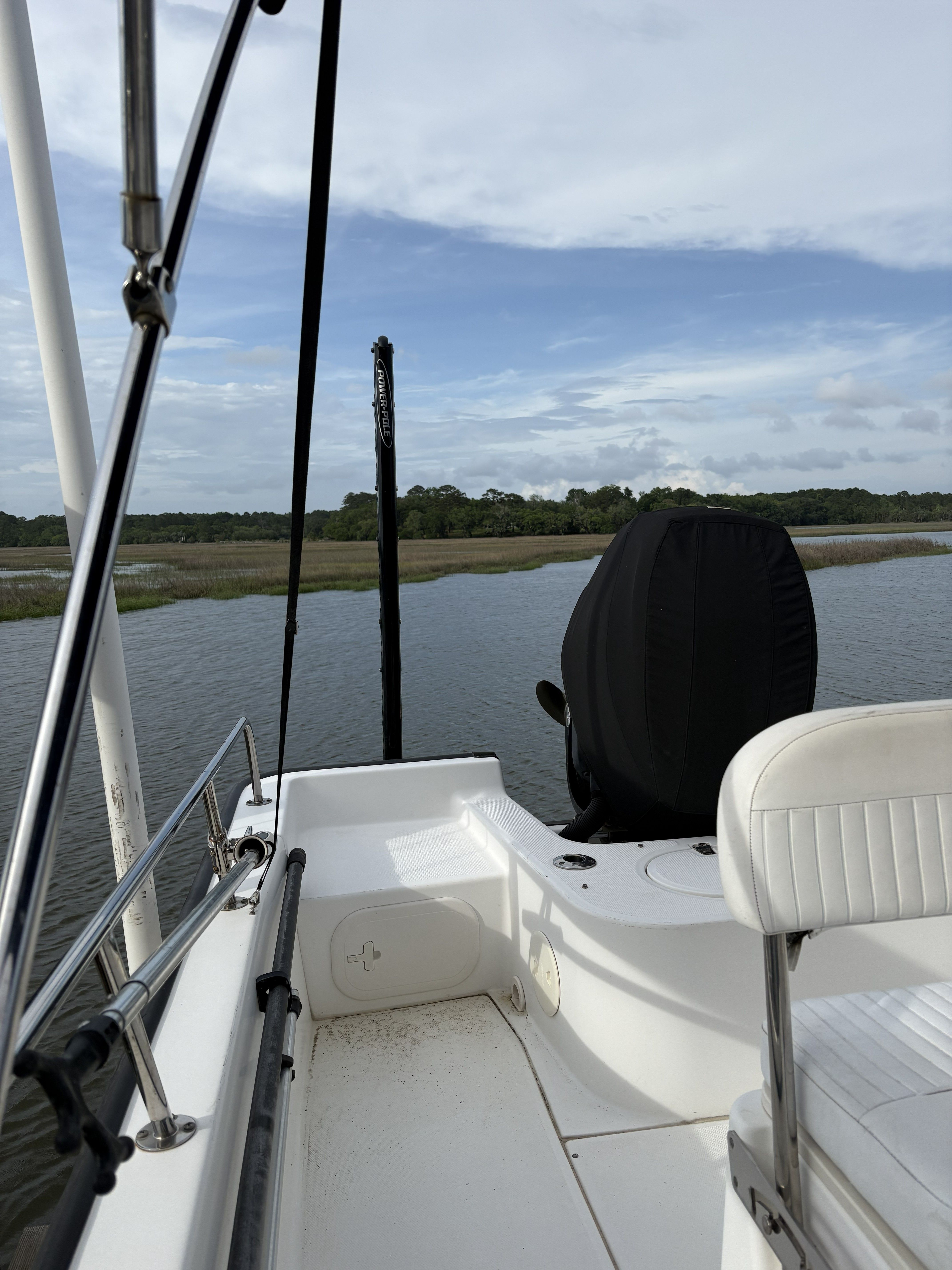Boston Whaler 190 Montauk 2012 on calm waters with cloudy sky.