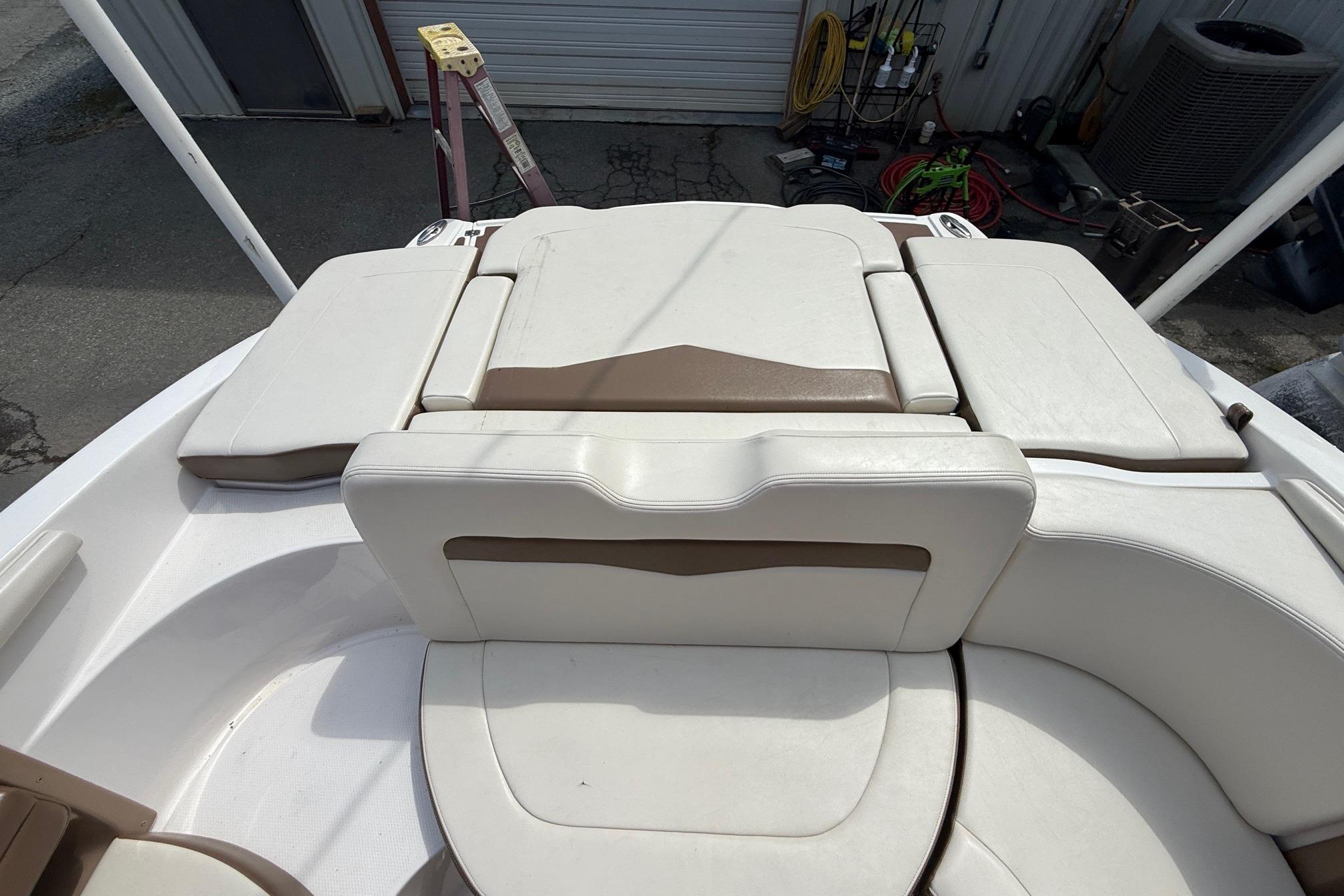 2016 Chaparral 226 SSi Wide Tech boat interior with white and brown seating.