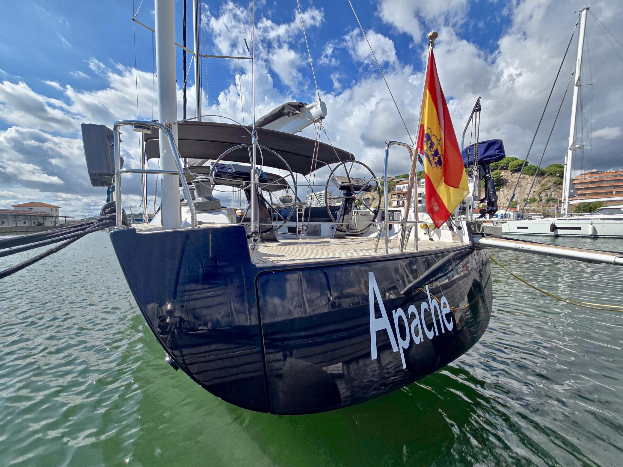 Sailing yacht Hanse 630e, 2009 model, docked with Spanish flag, named "Apache".