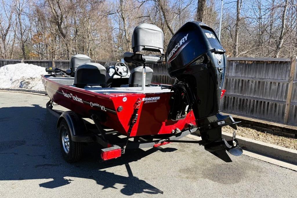 2026 Tracker Bass Tracker Classic XL boat with Mercury engine, parked outdoors.