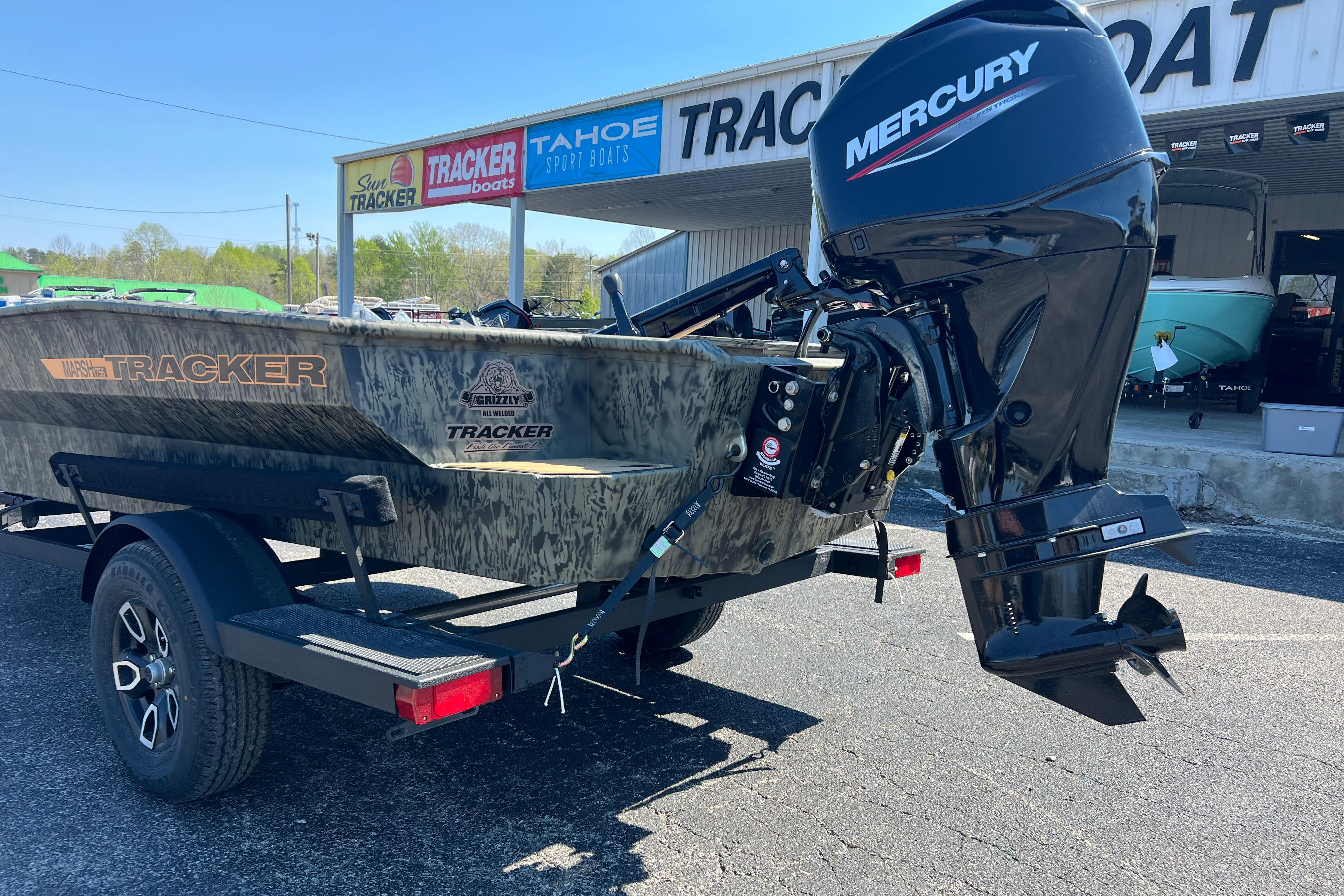 2026 Tracker Grizzly 1756 T Marsh boat with Mercury engine at dealership.