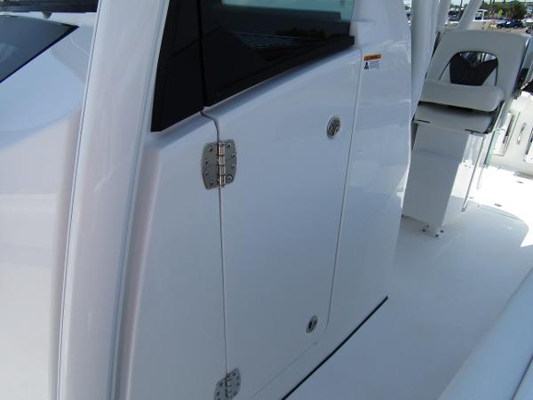 2024 Wellcraft 352 Fisherman boat, close-up of cabin door and seating area.
