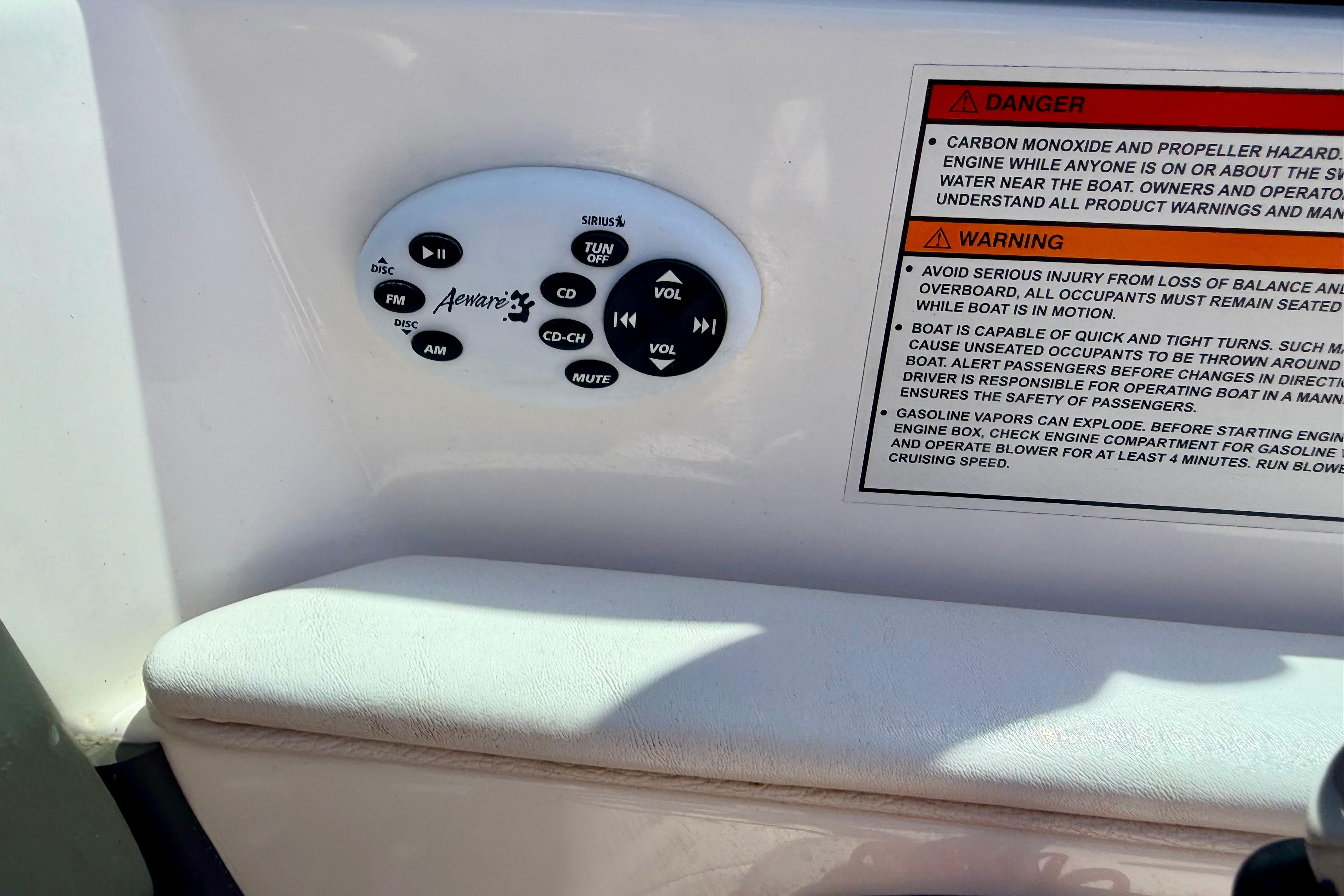 Control panel and safety warnings on a 2008 Moomba Outback V boat.