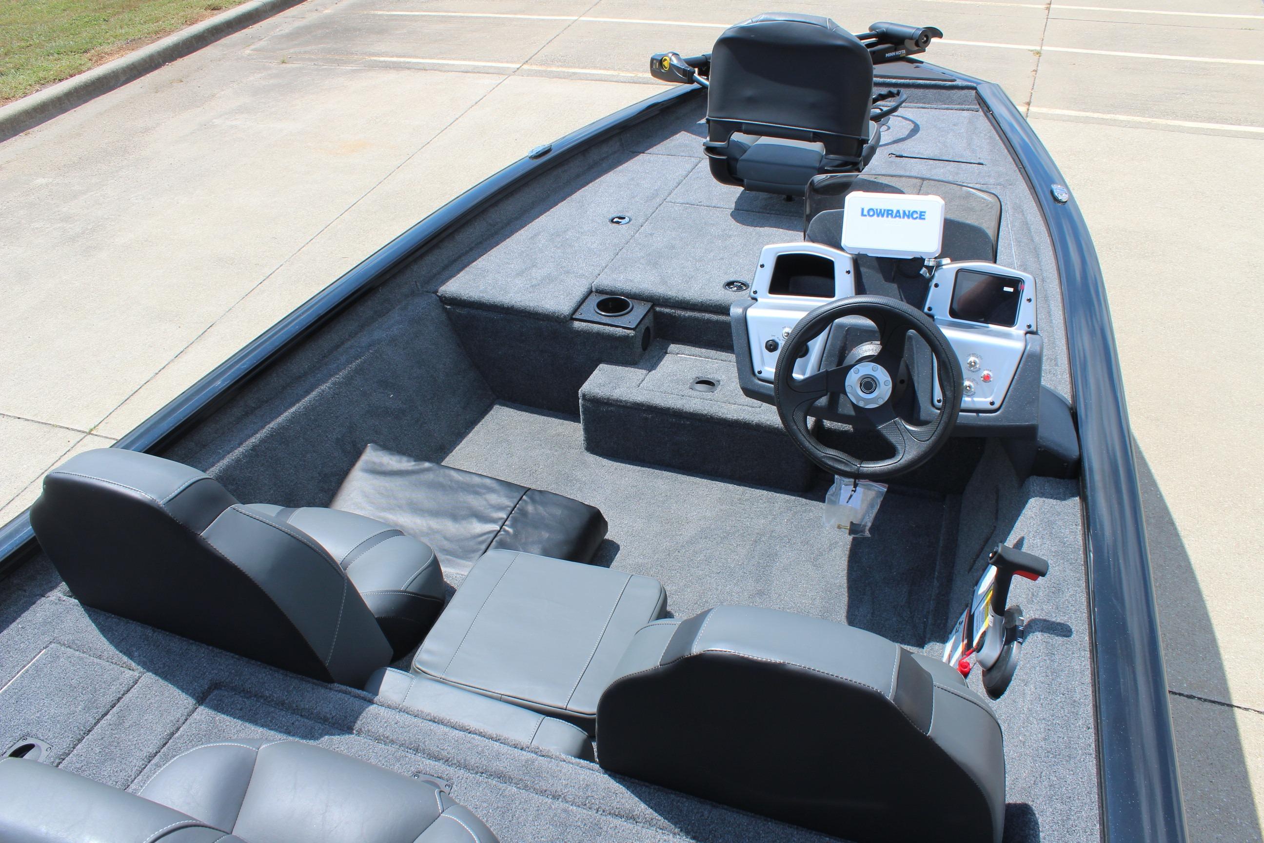 2026 Tracker Pro Team 175 boat interior with steering wheel and seating.