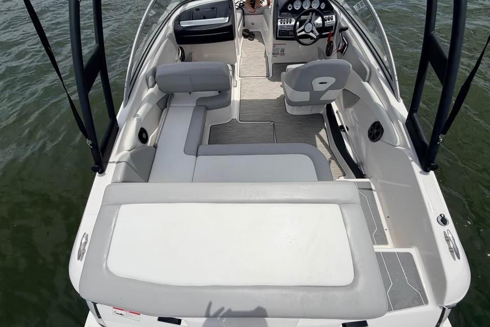 2019 Regal 1900 ES Bowrider interior with seating and steering wheel on water.