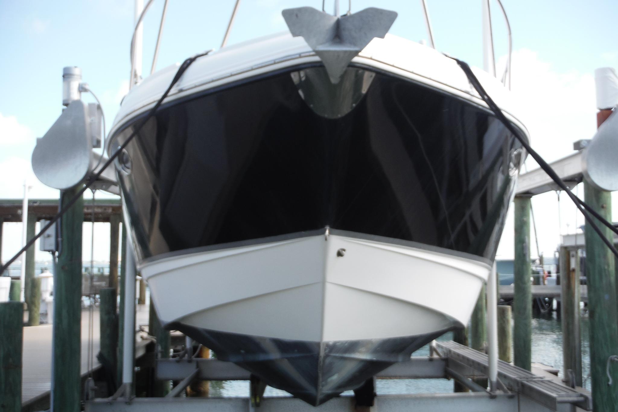2005 Chaparral Signature 350 boat docked, front view, in a marina setting.