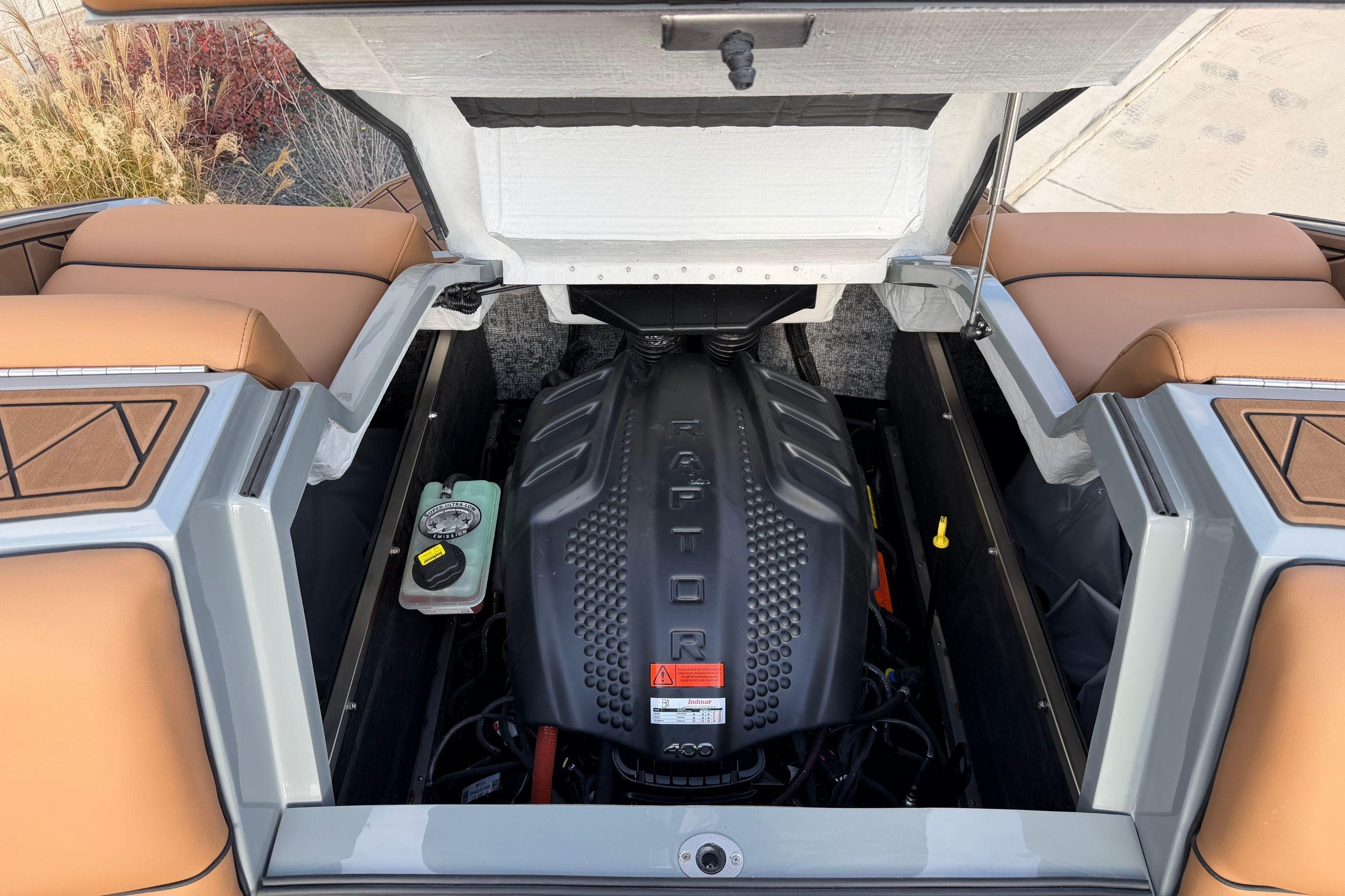 2026 MB B52 21 Alpha boat engine compartment with Raptor engine and tan seating.