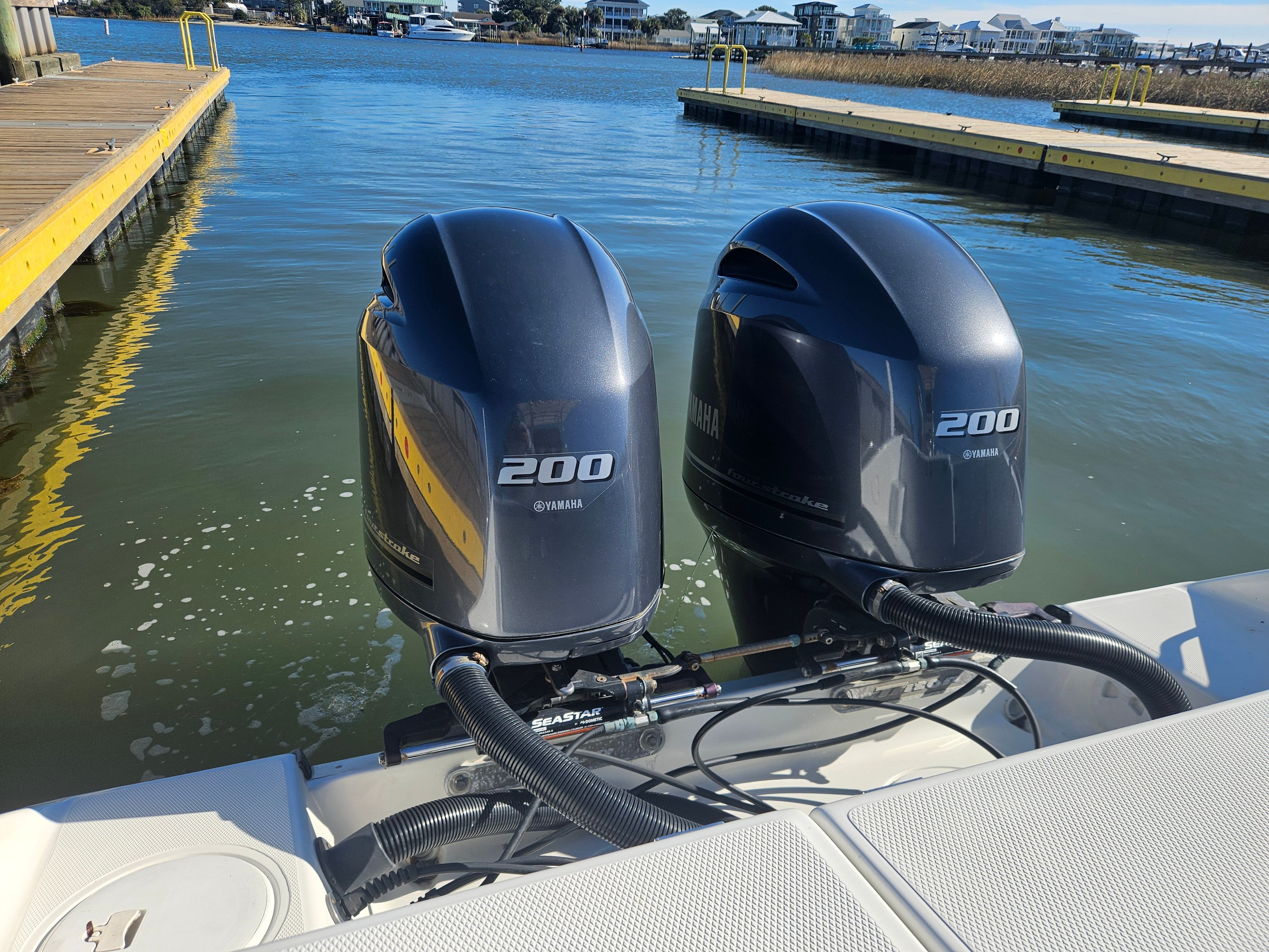 Two Yamaha 200 outboard motors on a Triton 2690 CC boat.