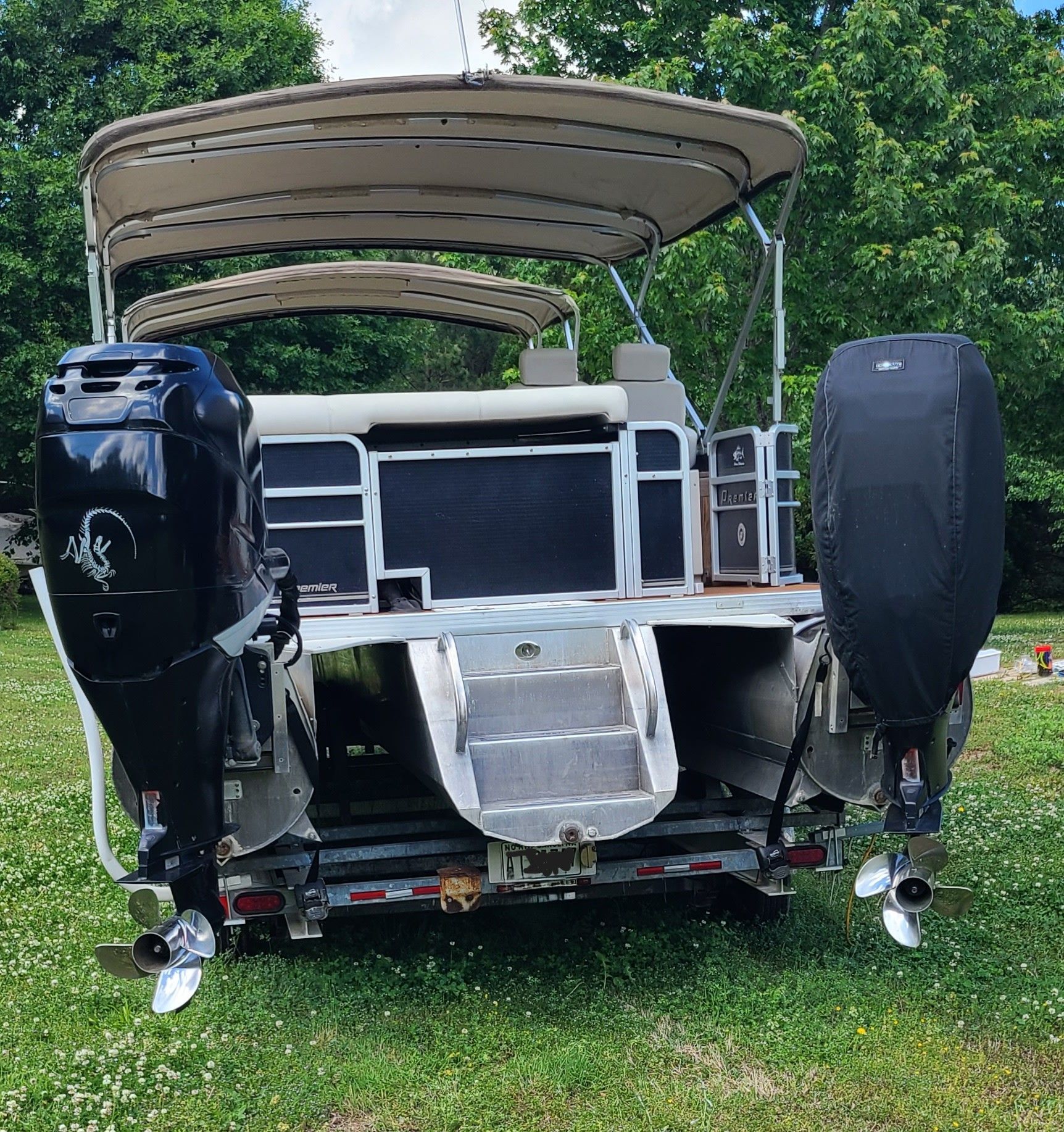 2009 Premier 275 Grand Majestic LTD pontoon boat with dual outboard motors.