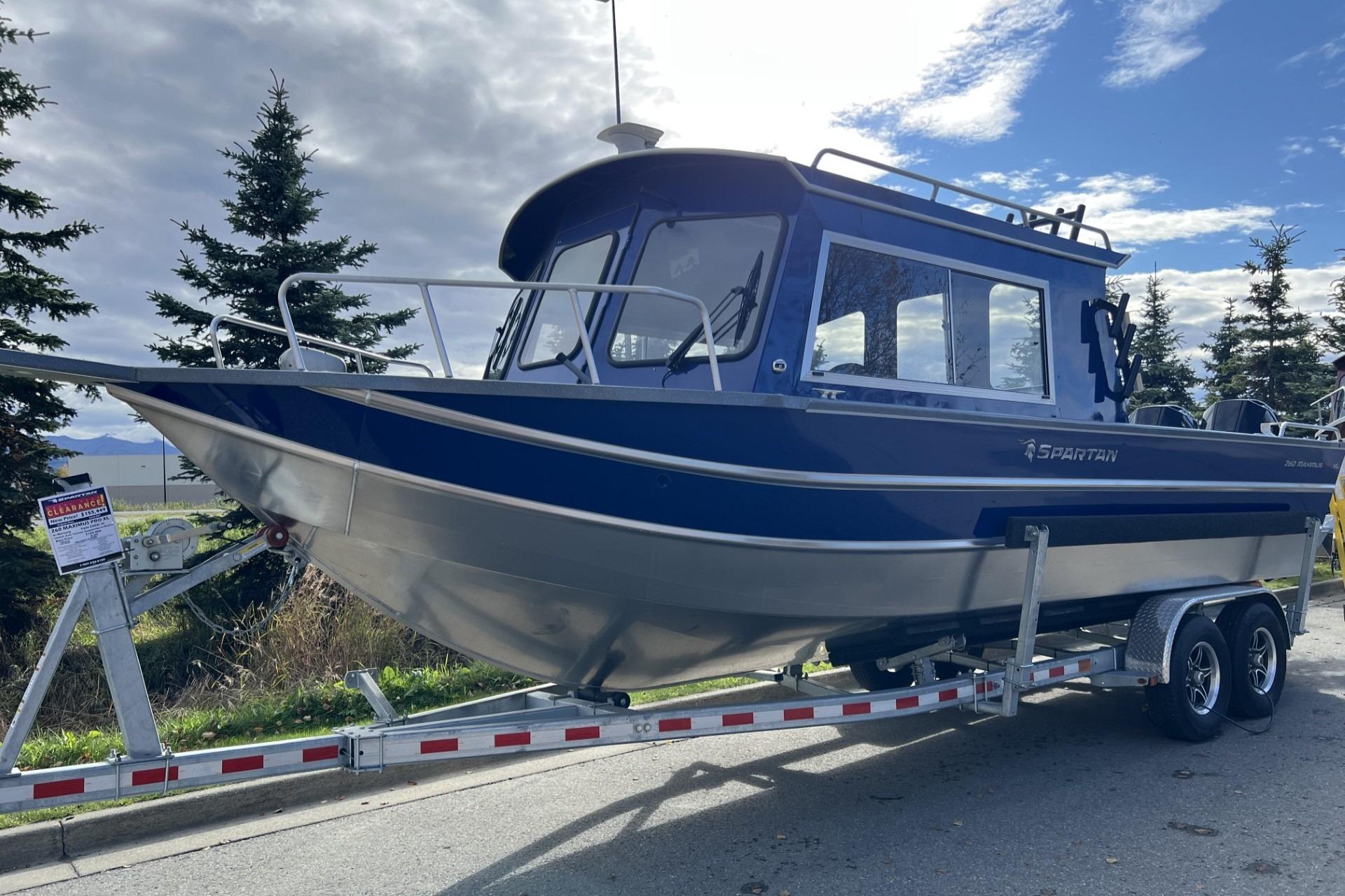 2024 Spartan 26 Maximus Pro XL boat on trailer, parked outdoors.