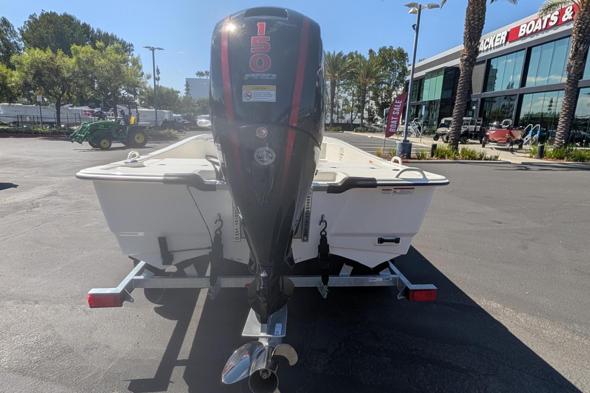 2026 Mako Pro Skiff 19 CC boat with 150 horsepower engine on trailer.