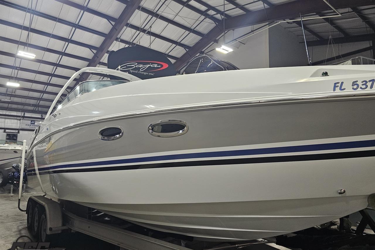 2008 Baja 335 Performance boat in a showroom, showcasing sleek design and modern features.