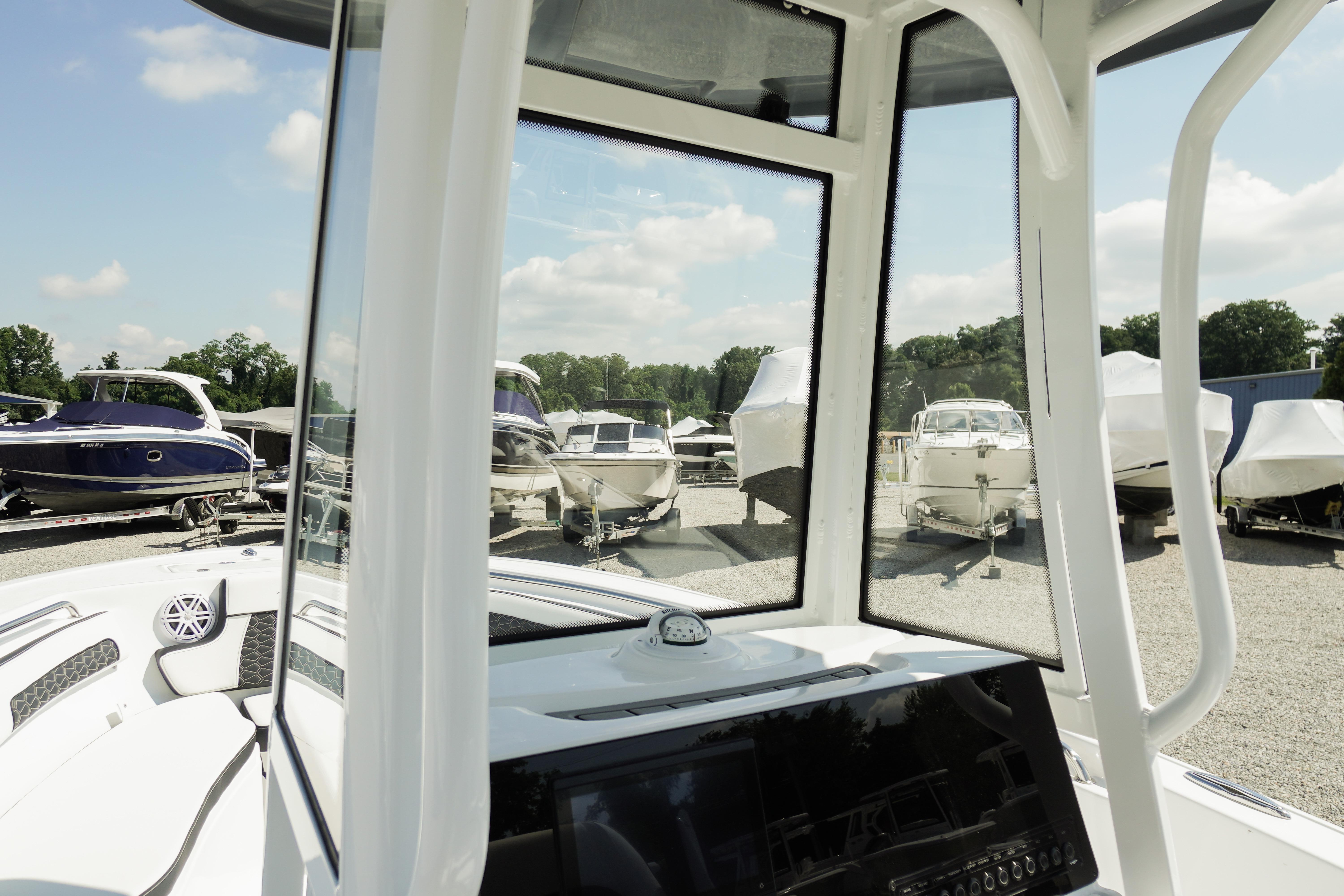 2026 Tidewater 220 CC Adventure boat interior view at a marina.