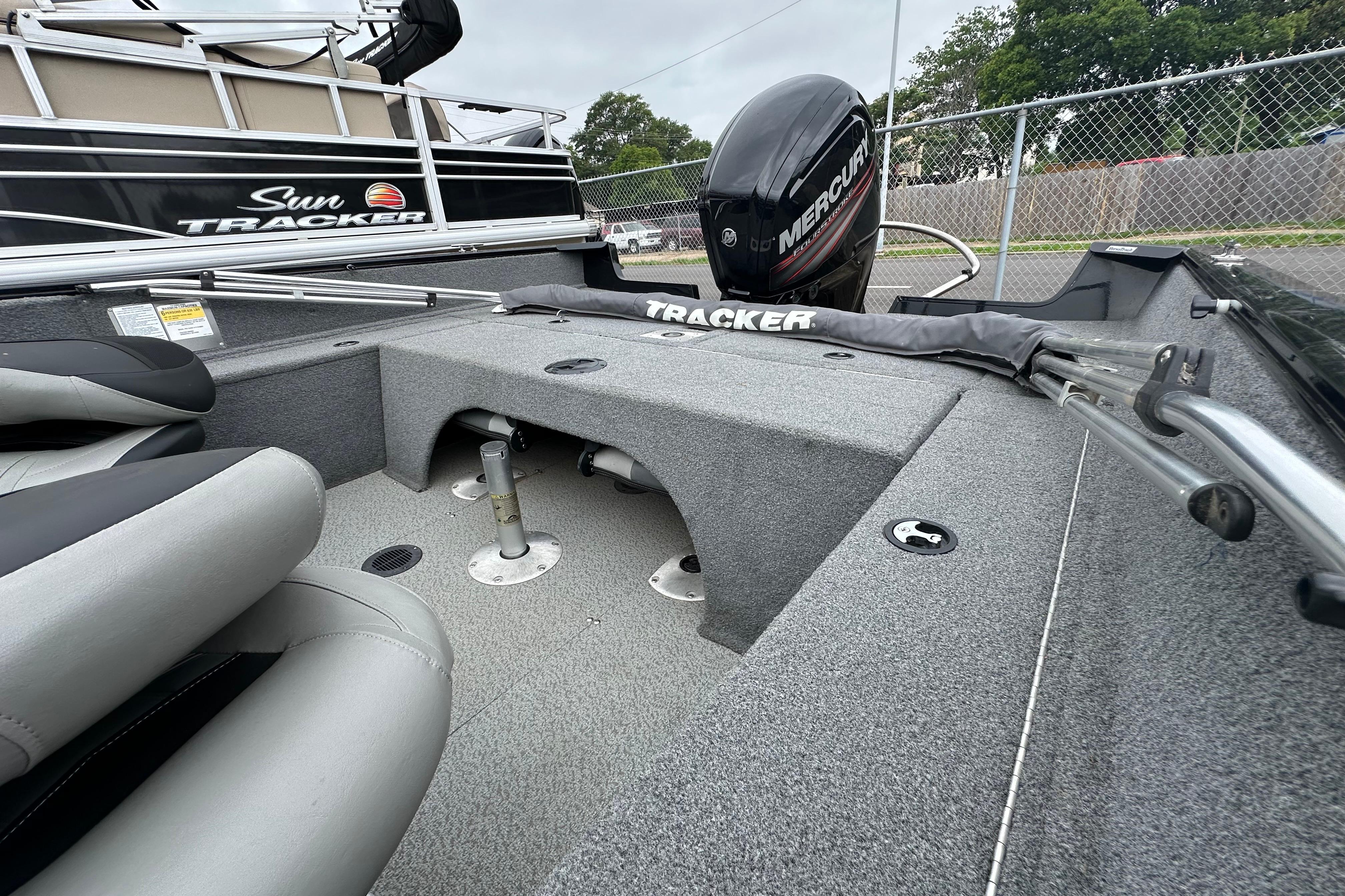 2018 Tracker Pro Guide V-175 Combo boat interior with Mercury engine, featuring seating and storage.