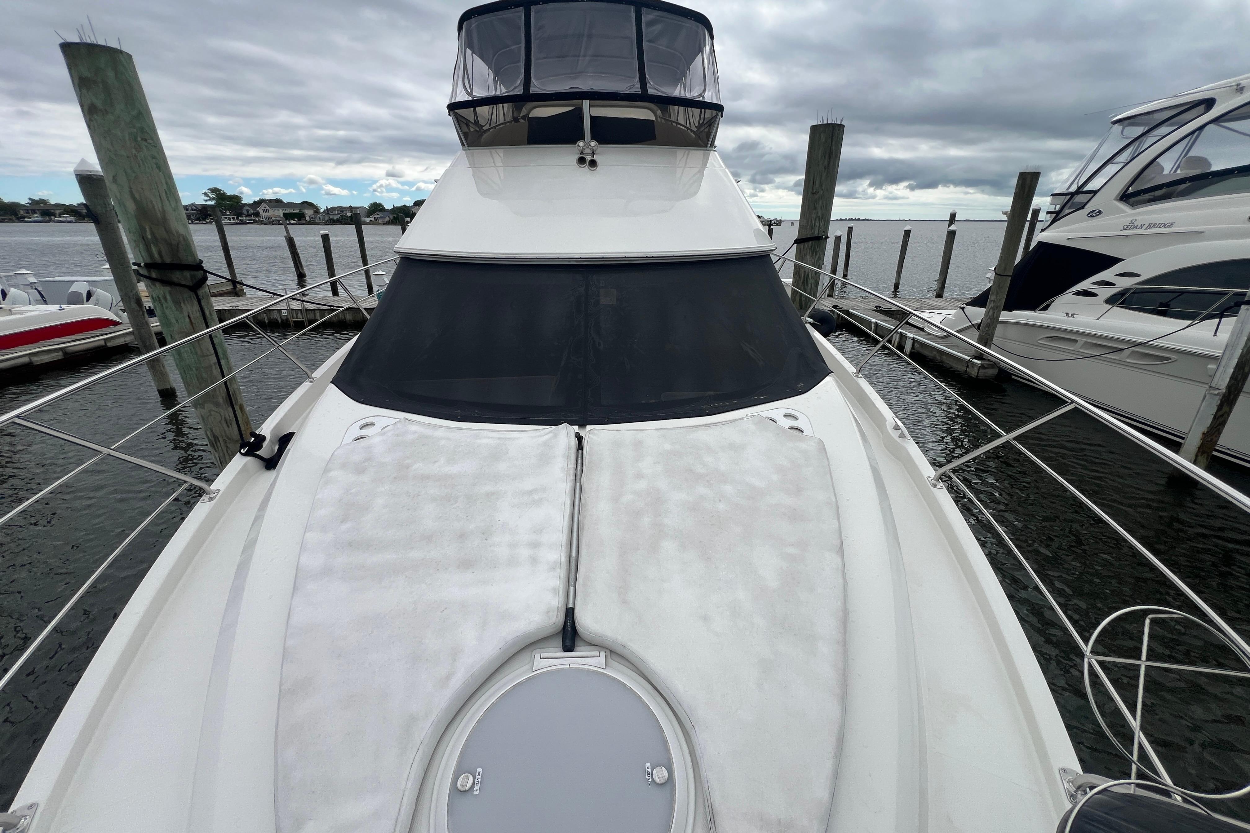 2006 Carver 43 Motor Yacht docked, showcasing sleek design and spacious deck.