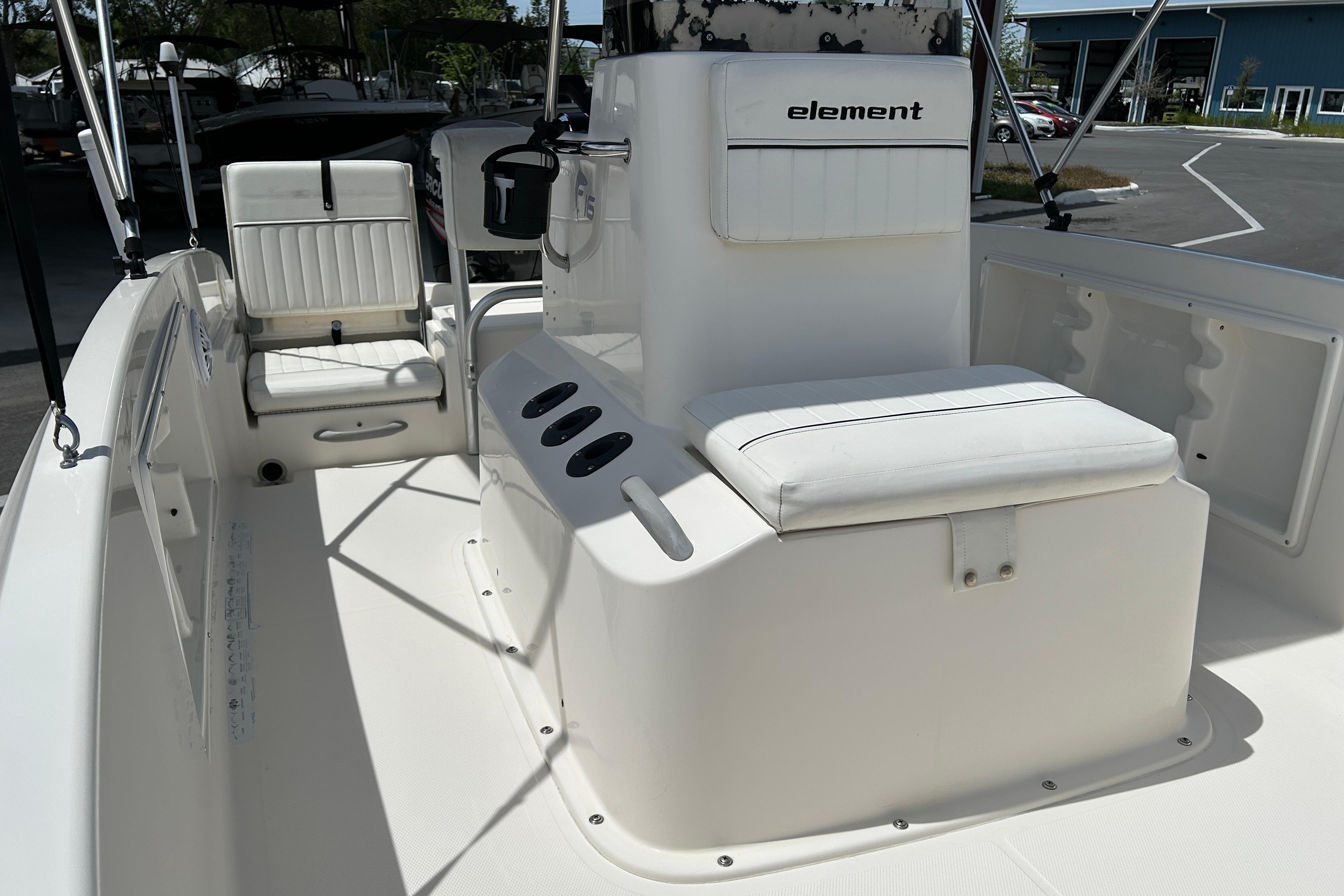 2018 Bayliner Element F16 boat interior with white seating and console.