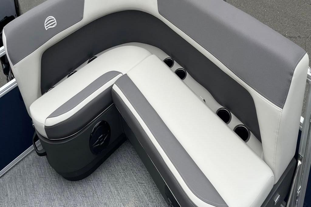 2026 Sun Tracker Bass Buggy 16 XL Select boat seating, featuring gray and white upholstery with cup holders.