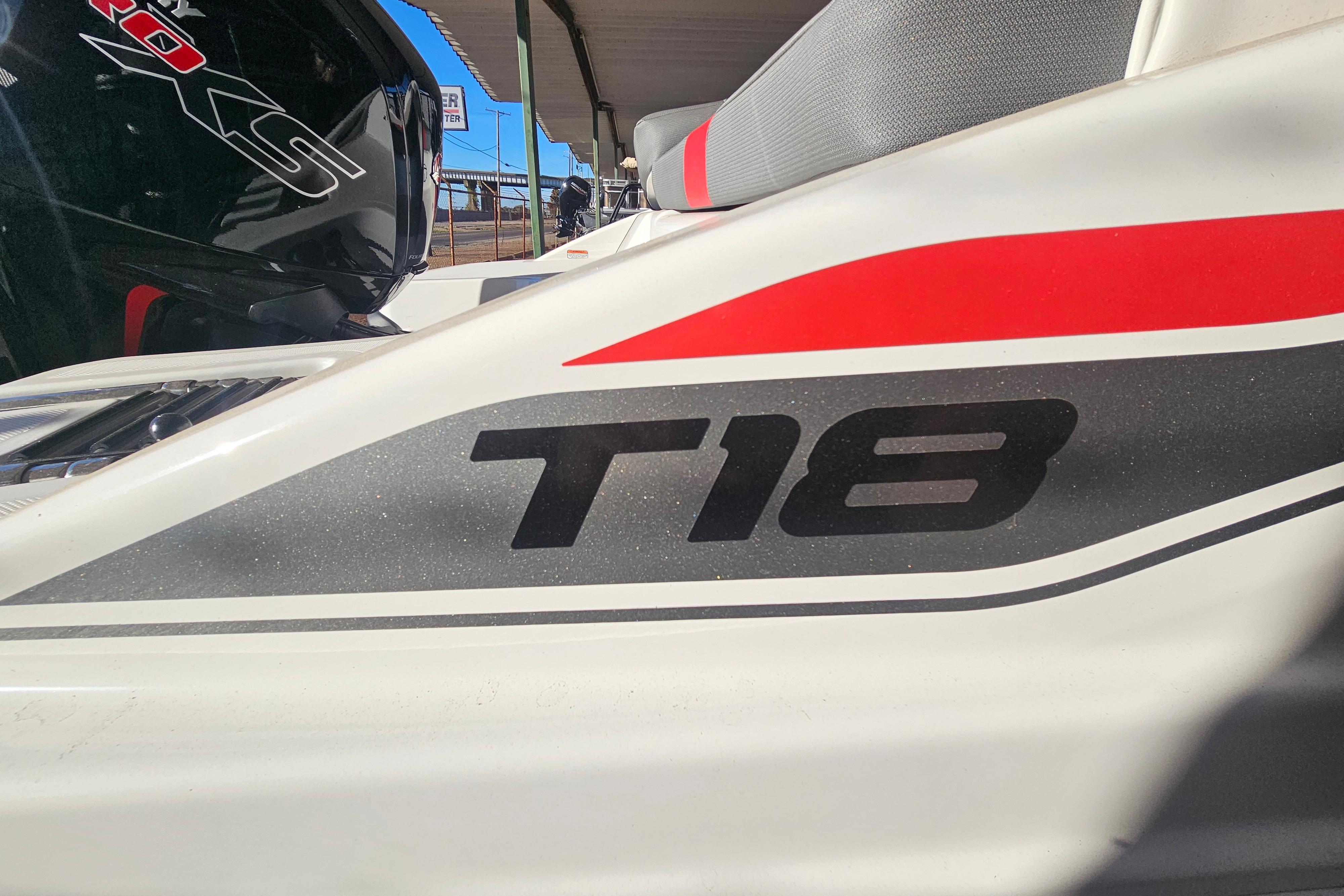 2026 Tahoe T18 boat with red and gray accents, close-up view.