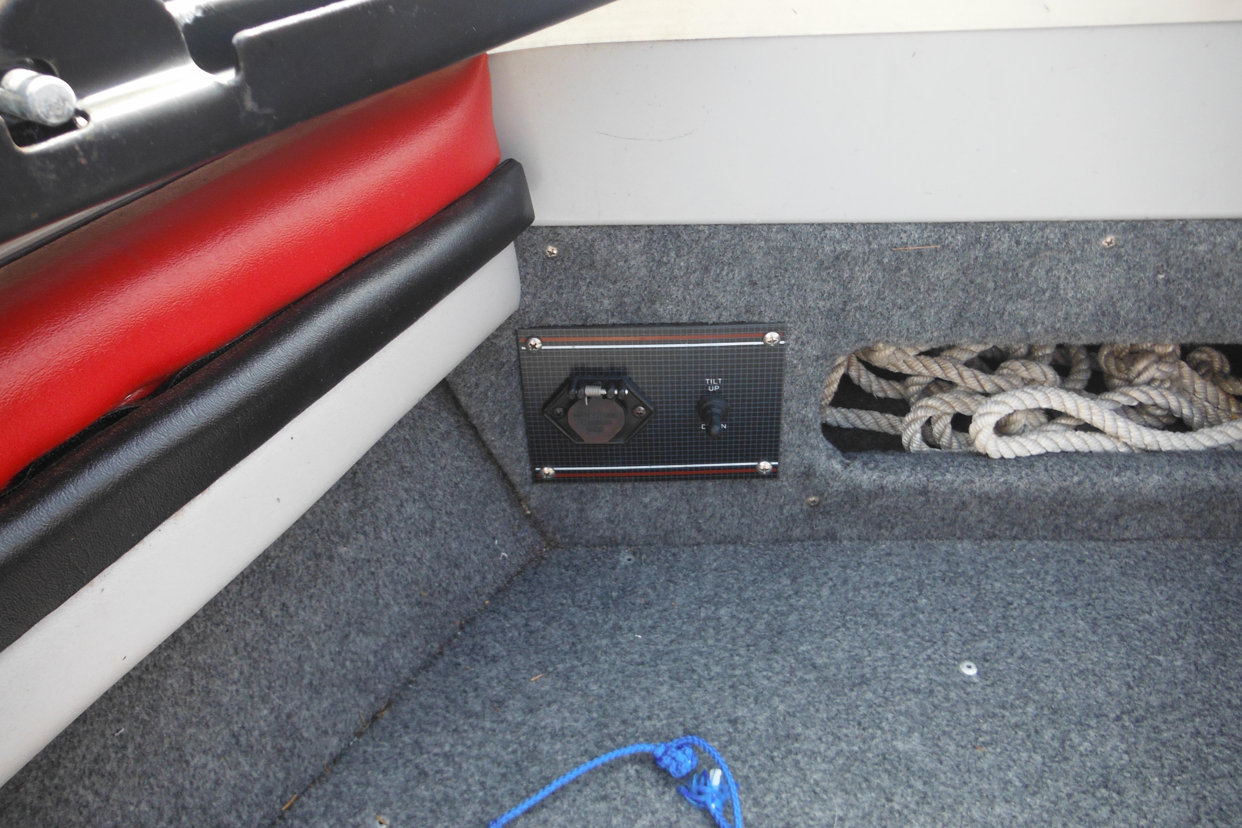 Interior of 1993 Sea Nymph SS175 Fish-n-ski boat with ropes and control panel.