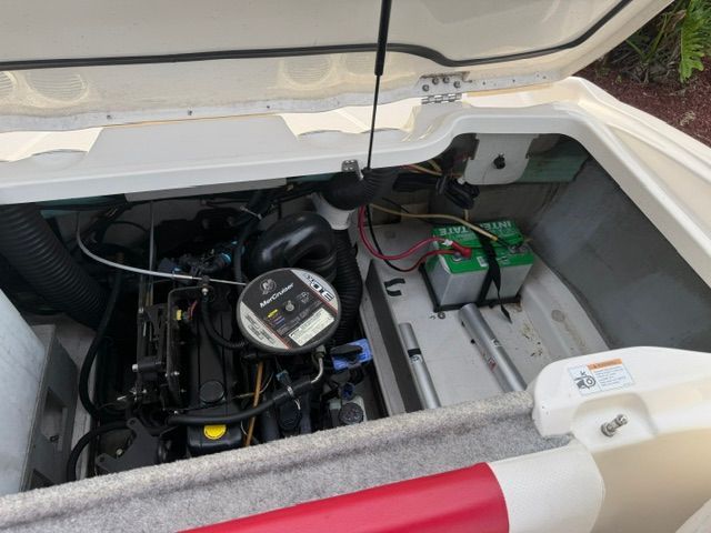 Engine compartment of a 2012 Bayliner 184 SF boat with battery.