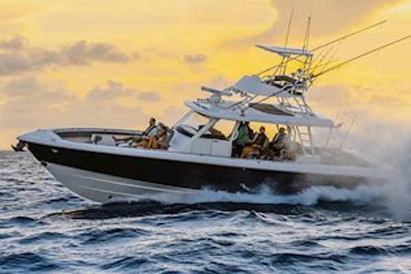Manufacturer Provided Image: 2025 Everglades 455 Center Console boat cruising at sunset on open water.