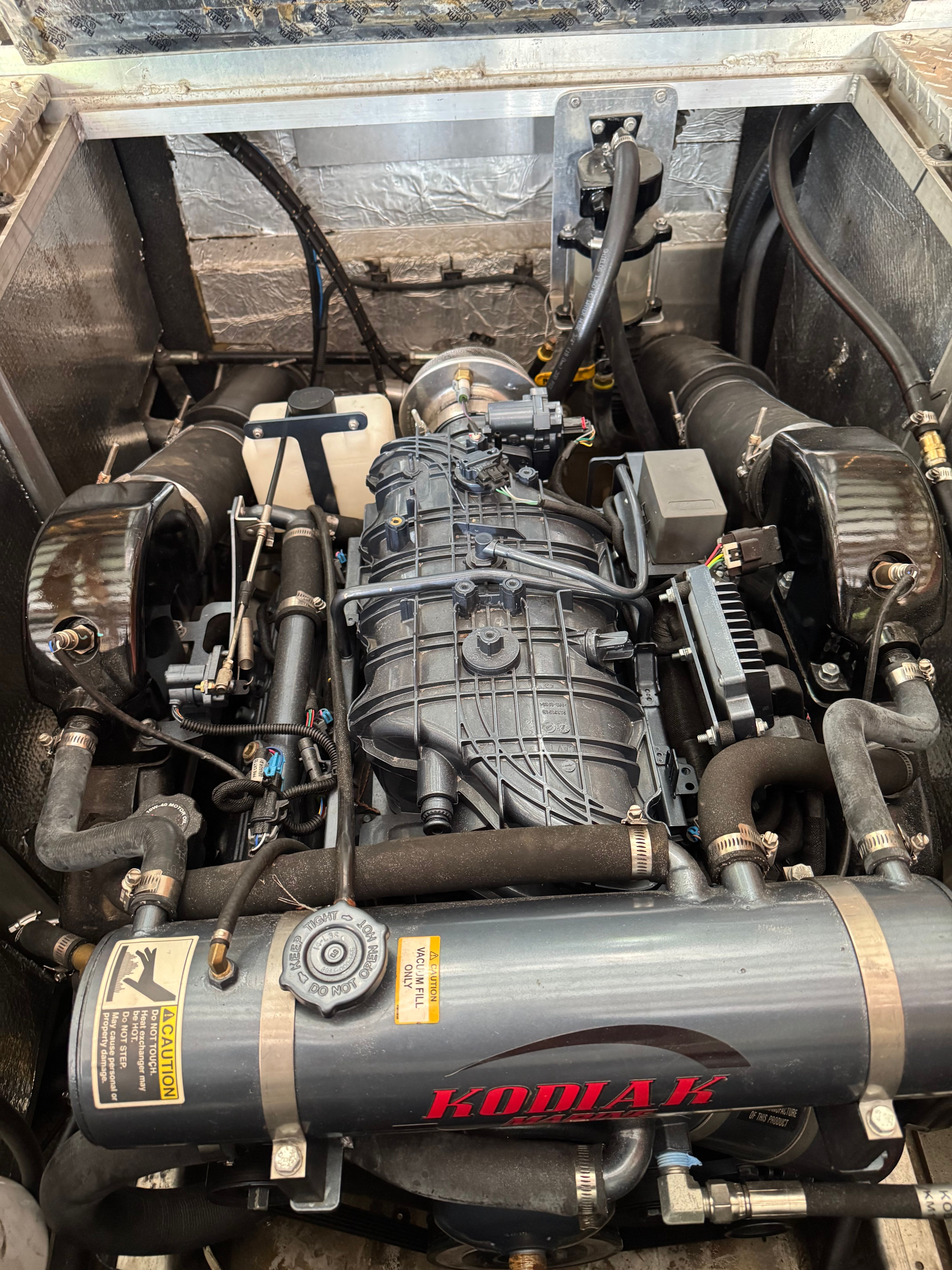 Engine compartment of a 2011 Custom RMX 24 boat.