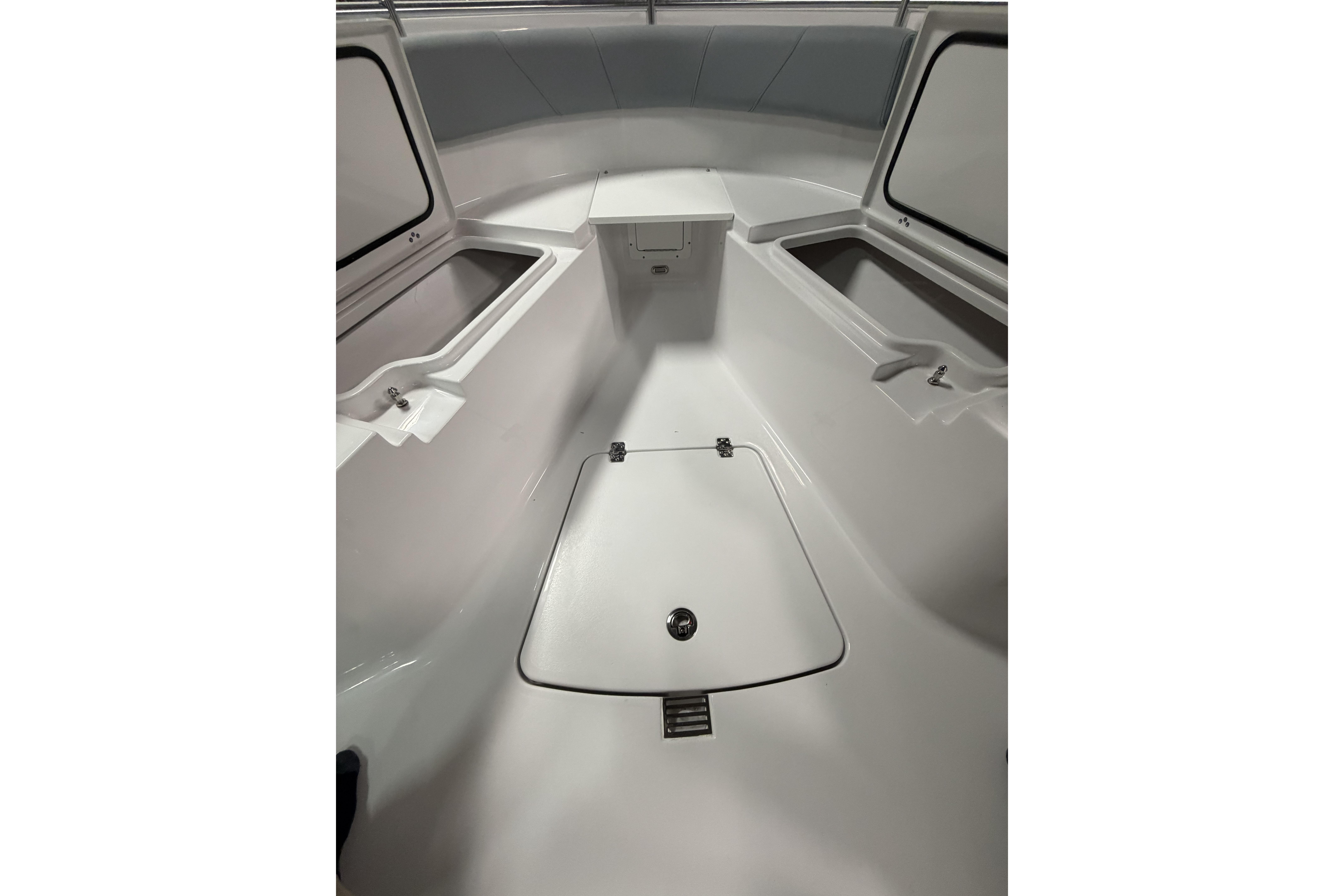 2026 Sportsman Open 232 Center Console boat interior with storage compartments.
