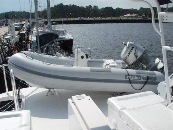 Inflatable boat with Honda motor on Great Harbour N40, 2025 model, docked at marina.