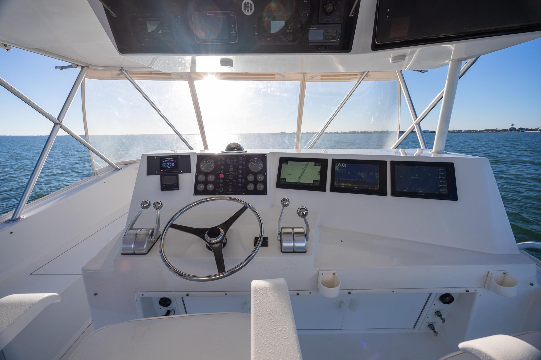 Cockpit view of 1998 Viking 50 Convertible yacht with navigation instruments.
