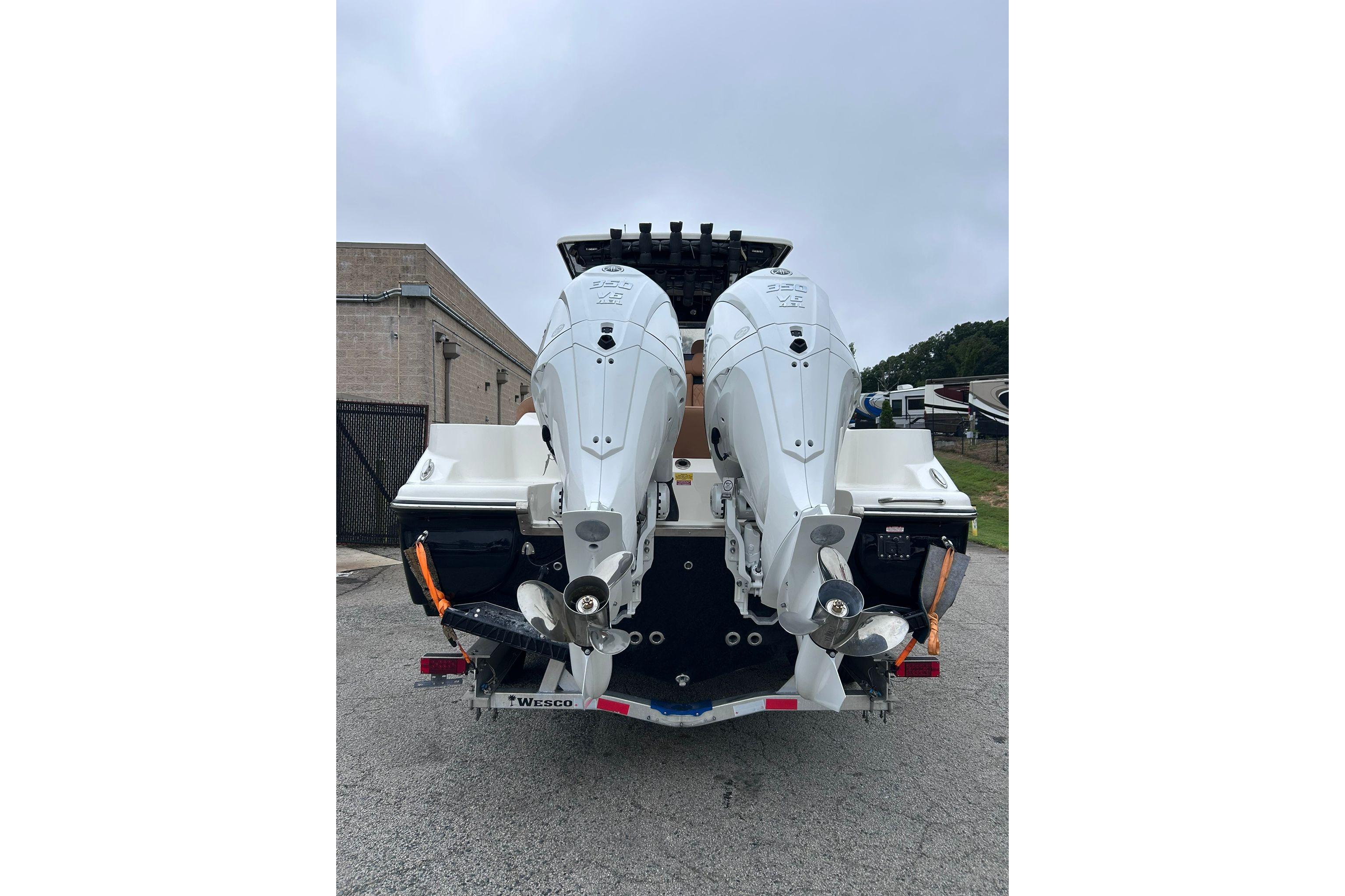 Rear view of 2026 Key West 291 FS boat with dual outboard engines.