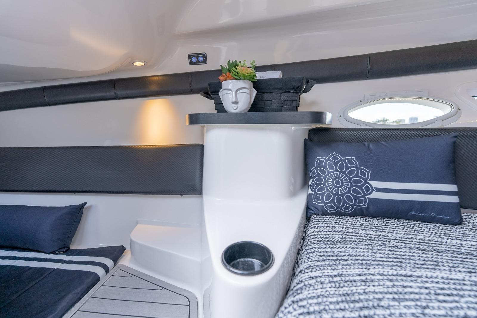 Interior of 2027 Hanover 305 boat with modern decor and comfortable seating.