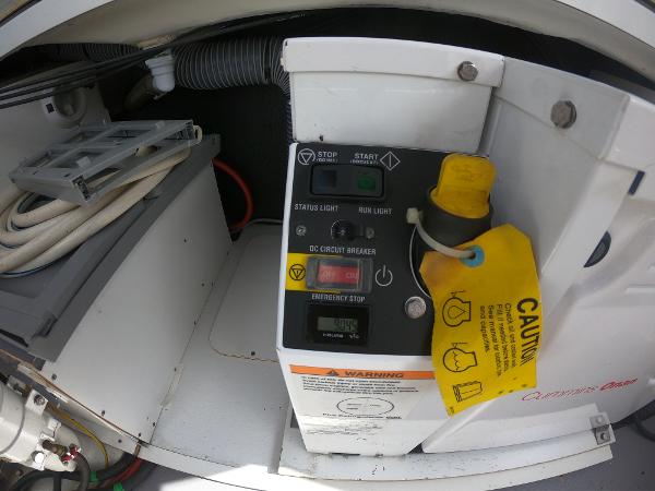 Control panel of a 2017 Jeanneau NC 11 boat with caution tag.