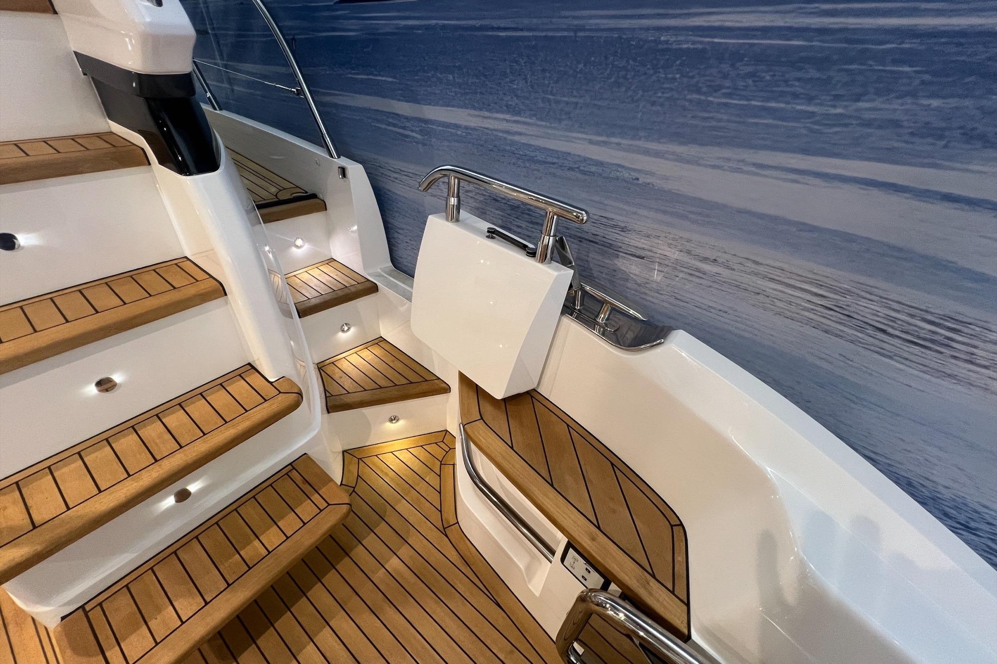 Luxurious 2019 Princess F45 yacht with elegant teak steps and modern design.