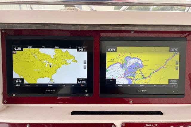 Dual Garmin navigation screens on a 2001 Fountain 38 Center Console boat dashboard.