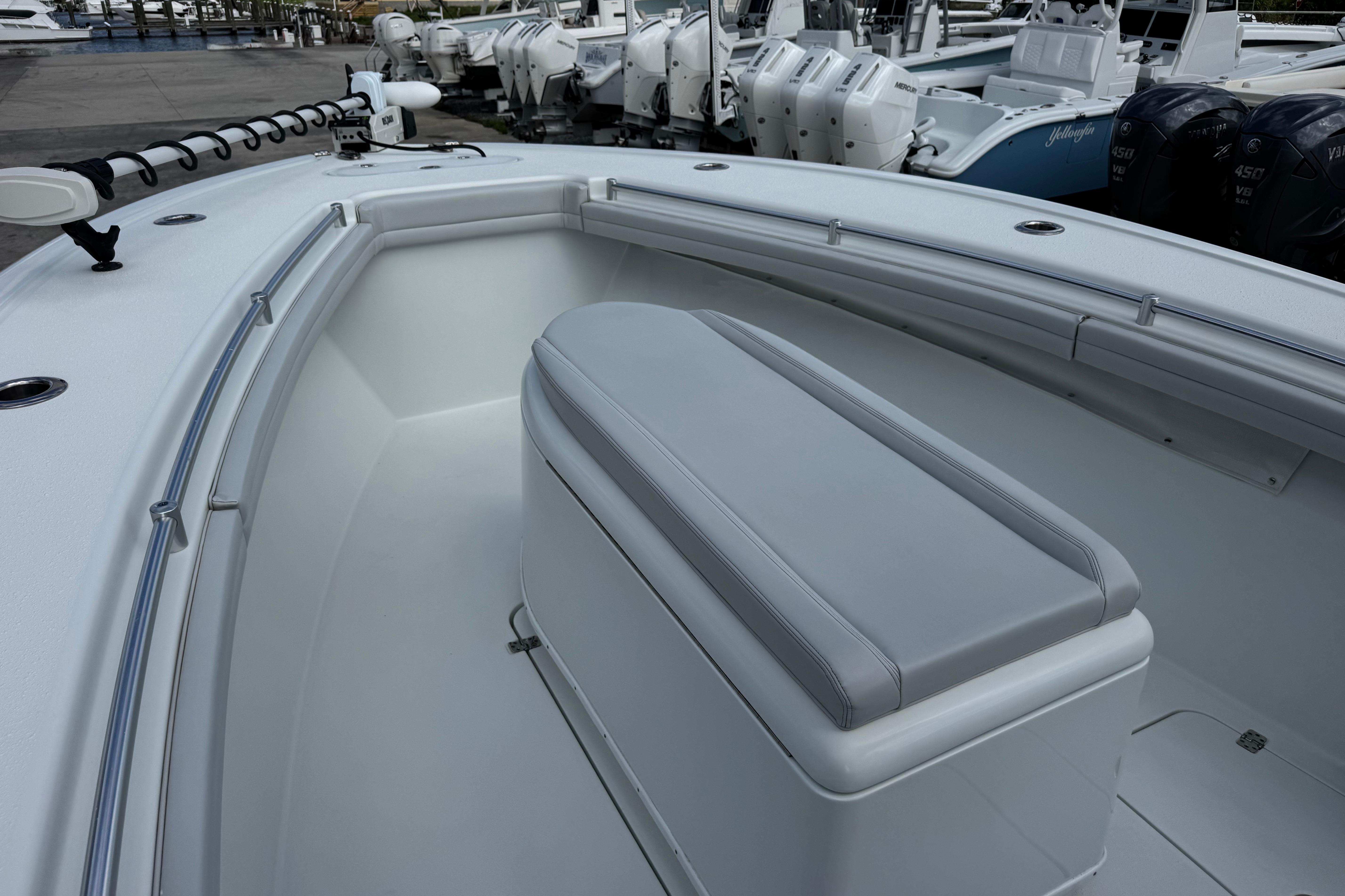 2022 Yellowfin 32 Offshore boat interior with seating and storage.