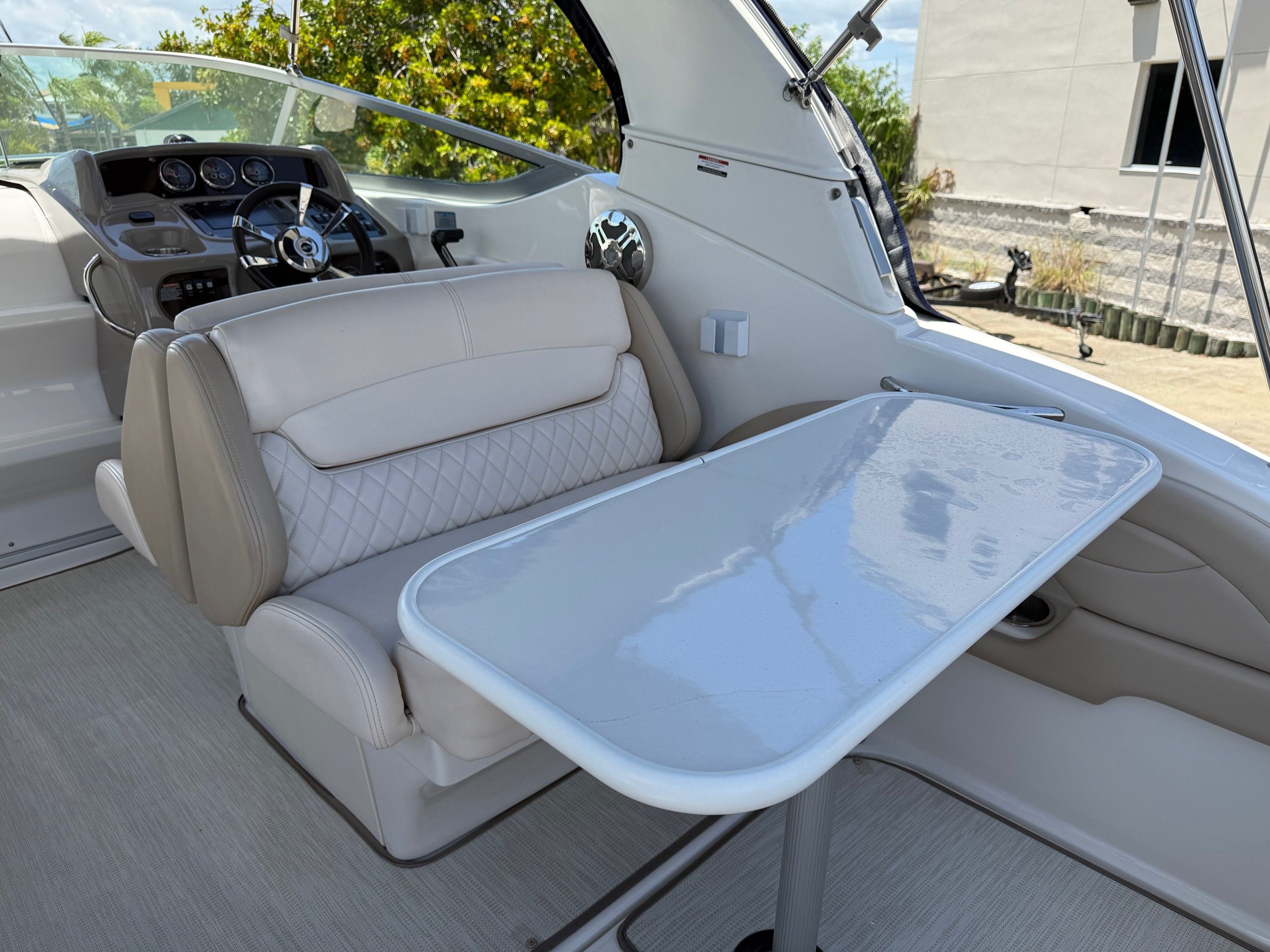 Interior of 2018 Chaparral 270 Signature boat with table and seating.