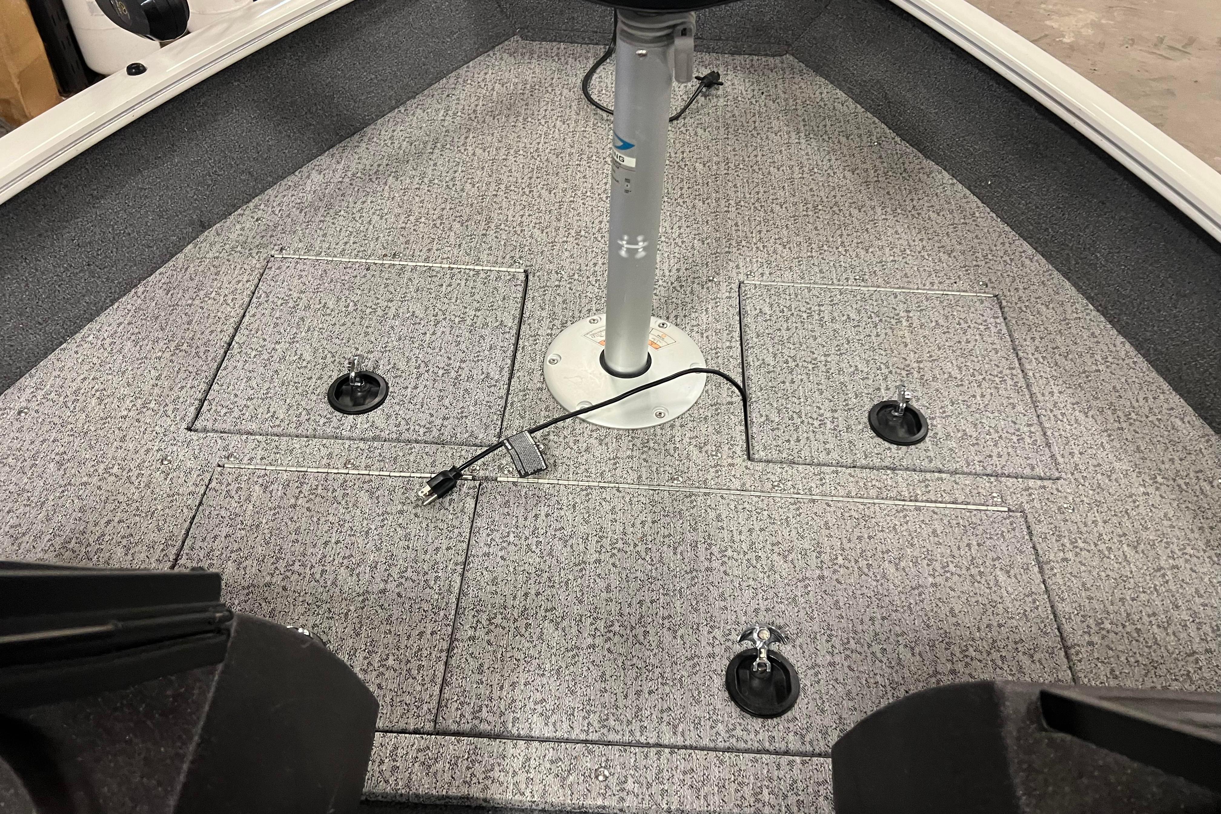 2022 Tracker Pro Guide V-16 WT boat interior with storage compartments and pedestal base.