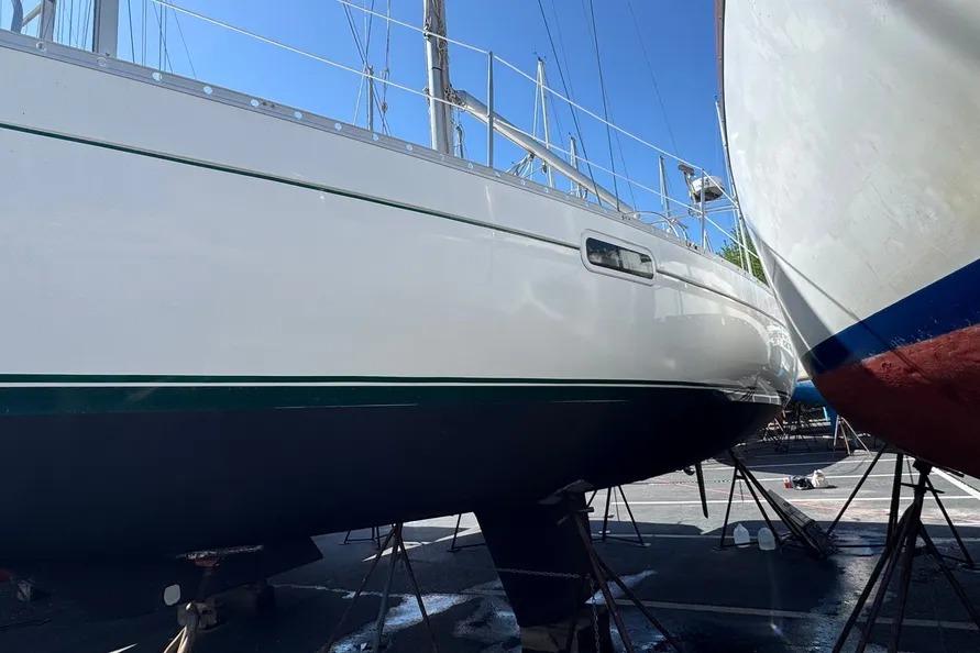Beneteau Oceanis 321 sailboat from 2000 on dry dock, side view.