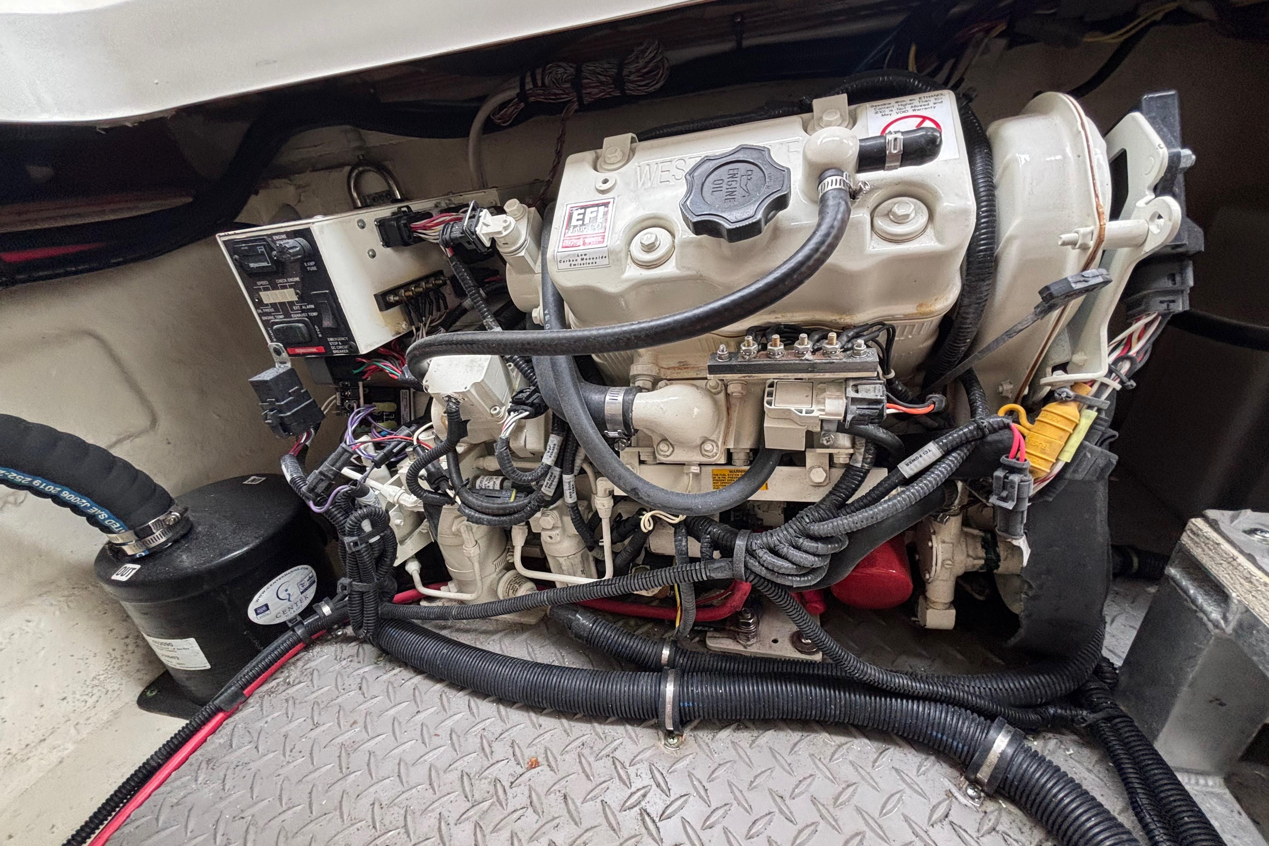 Engine compartment of a 2021 Sea Ray Sundancer 320 Outboard boat.