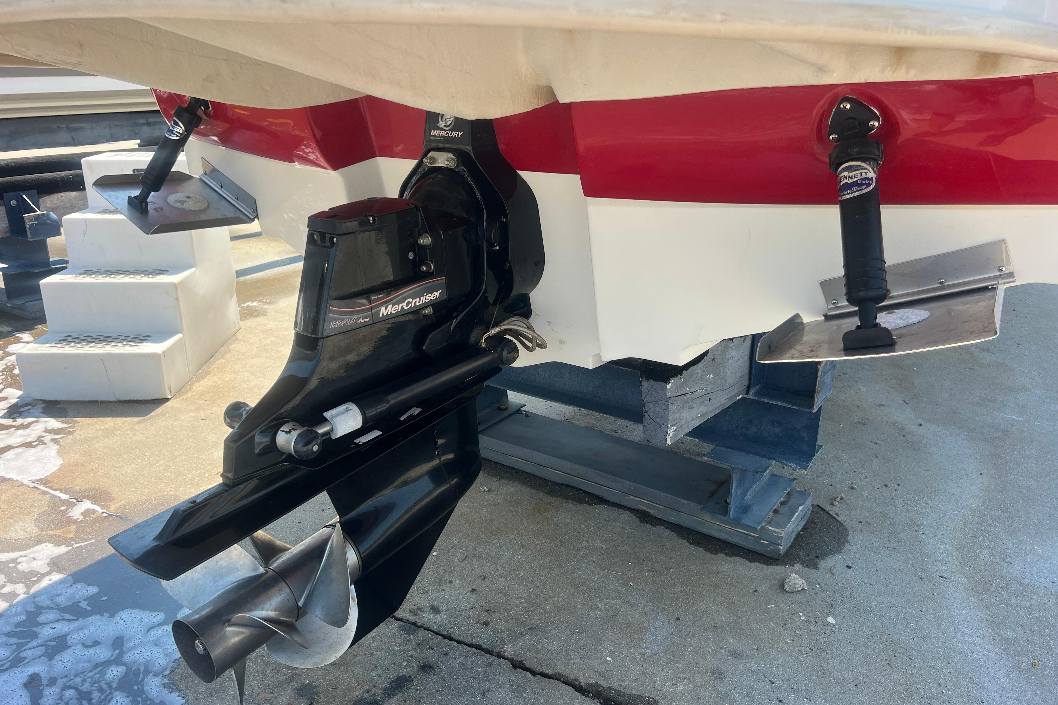 2005 Sea Ray 240 Sundeck boat with MerCruiser engine and trim tabs.
