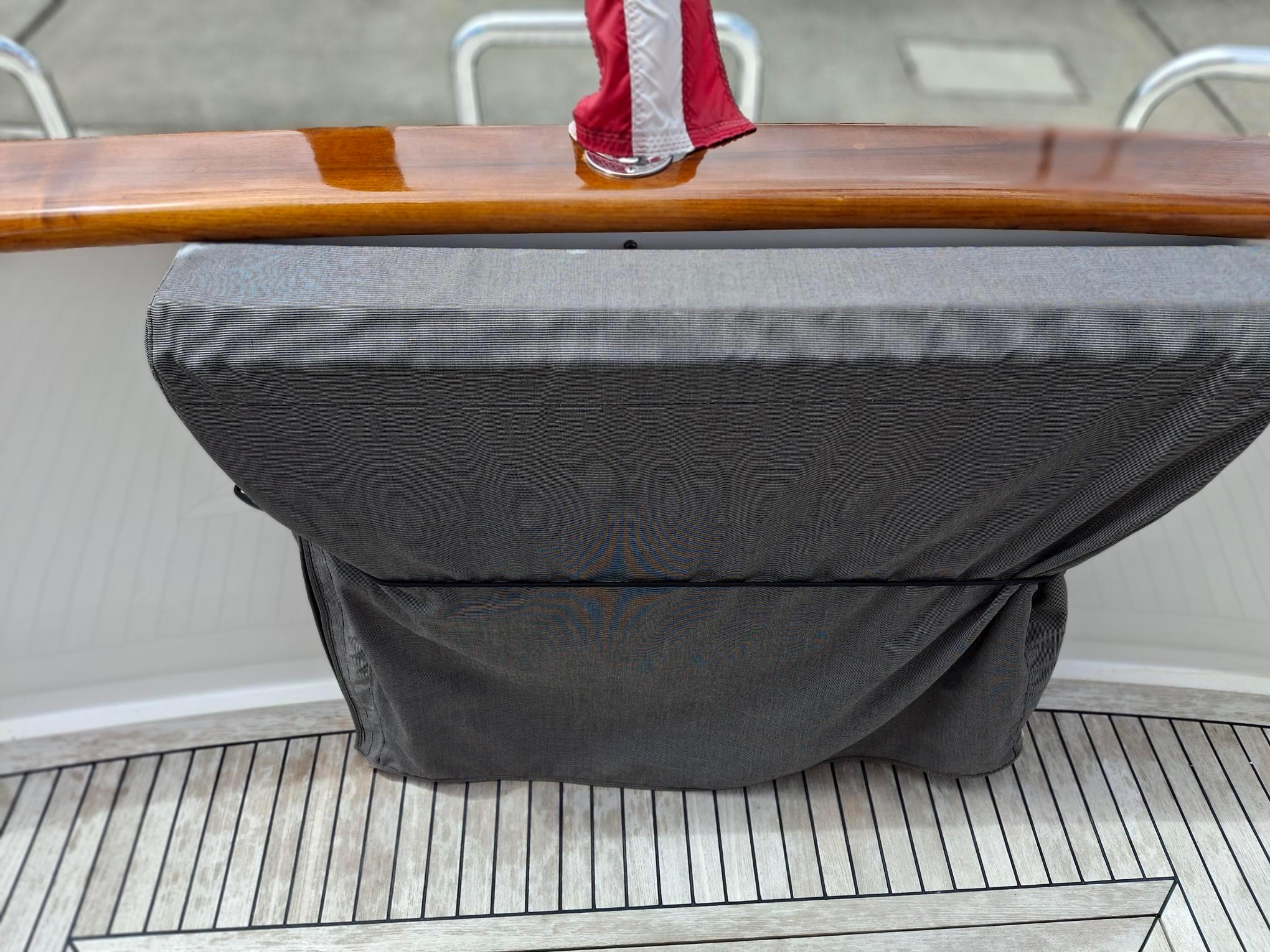 Covered seating on 2004 Ocean Alexander 64 Pilothouse yacht deck.
