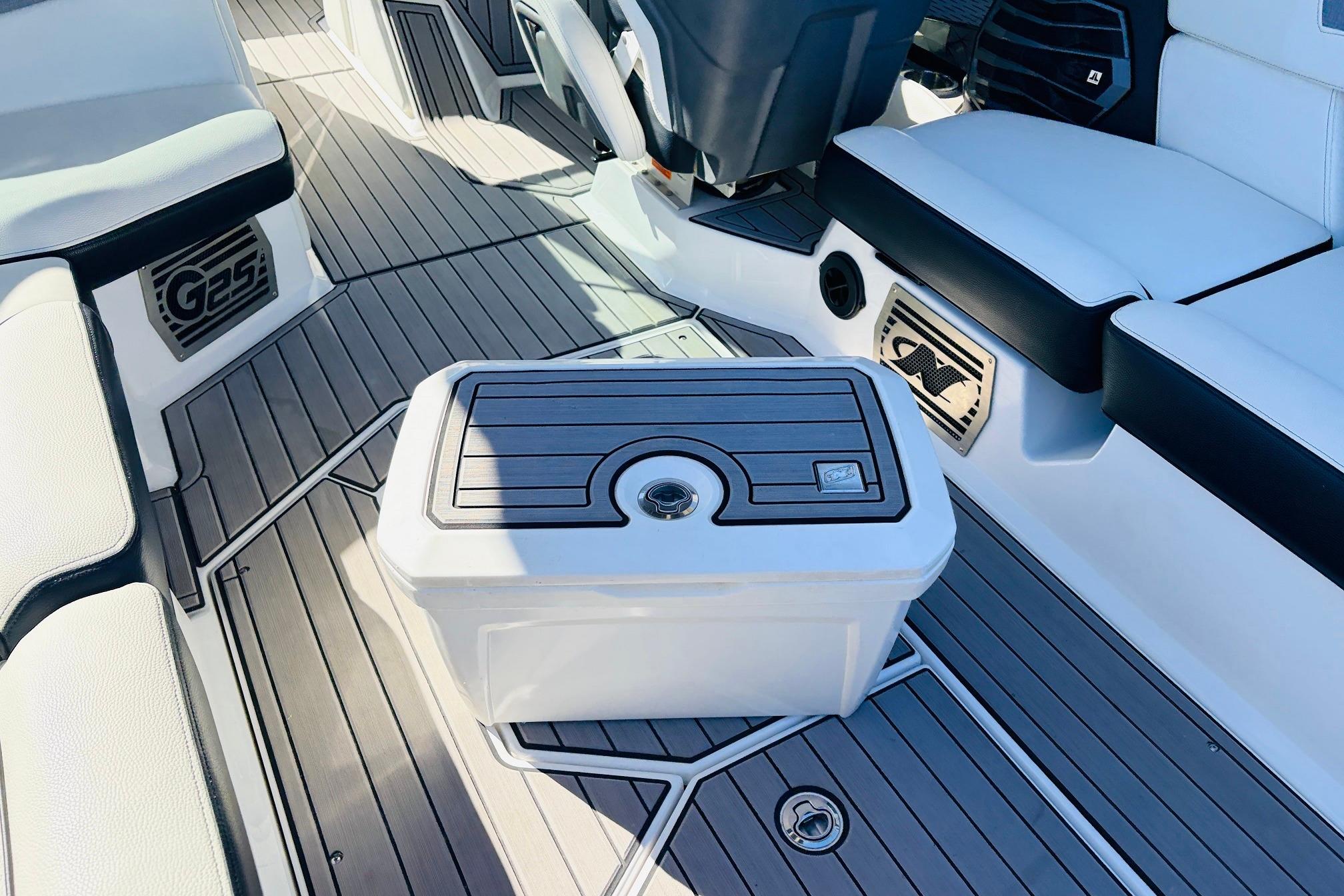 2023 Nautique Super Air Nautique G25 interior with sleek seating and modern flooring design.
