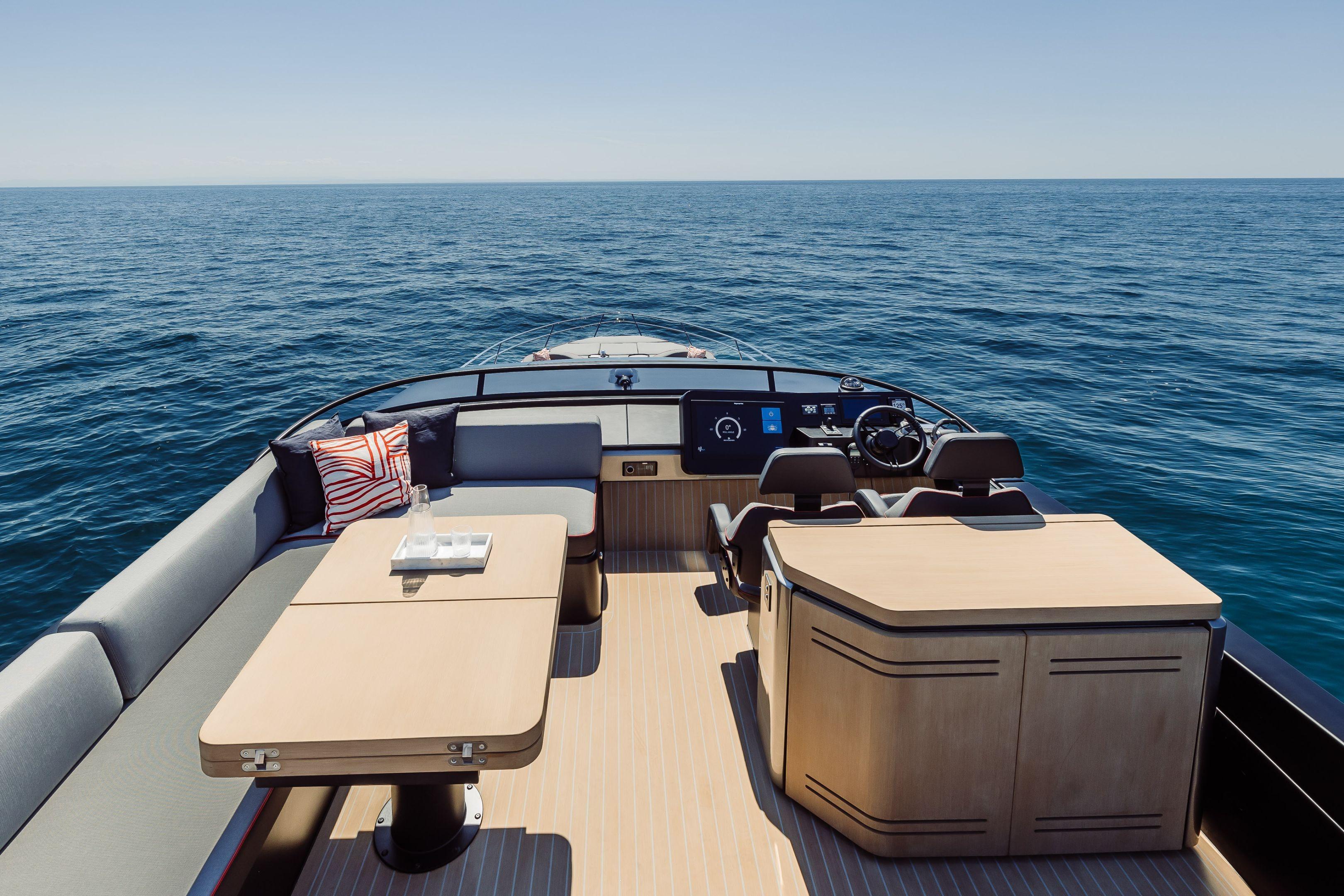 Luxurious 2026 Cranchi Sessantasette 67 Corsa yacht interior with ocean view.