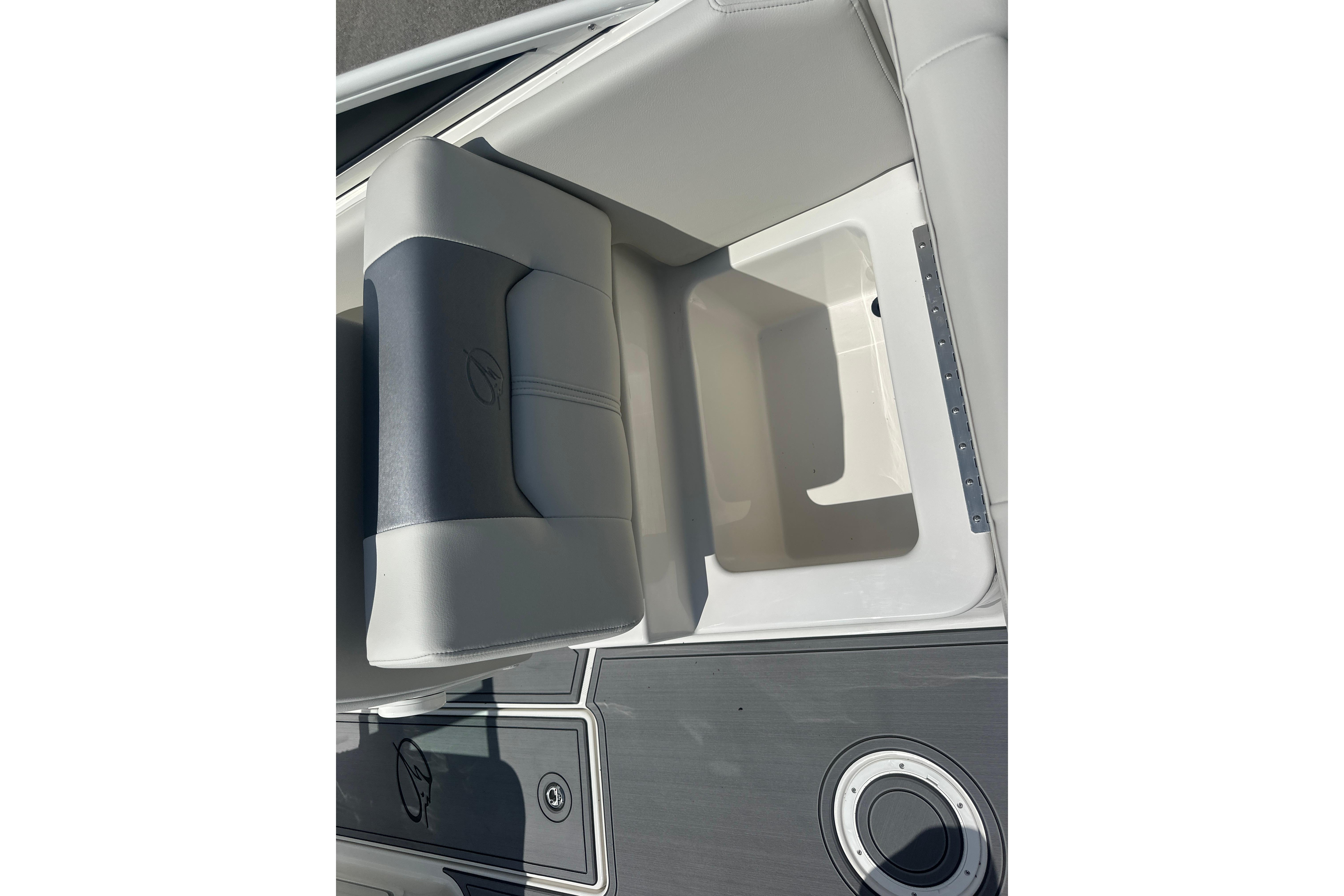 2026 Sailfish 226 DC boat seat with storage compartment, featuring sleek design and modern materials.