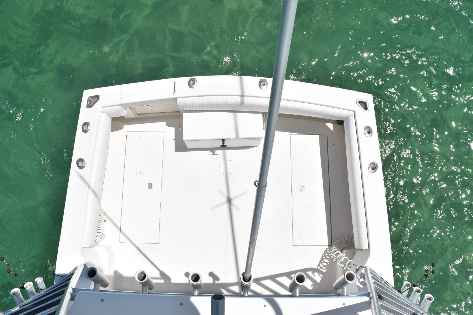Top view of 2006 Carolina Classic 32 boat deck on turquoise water.
