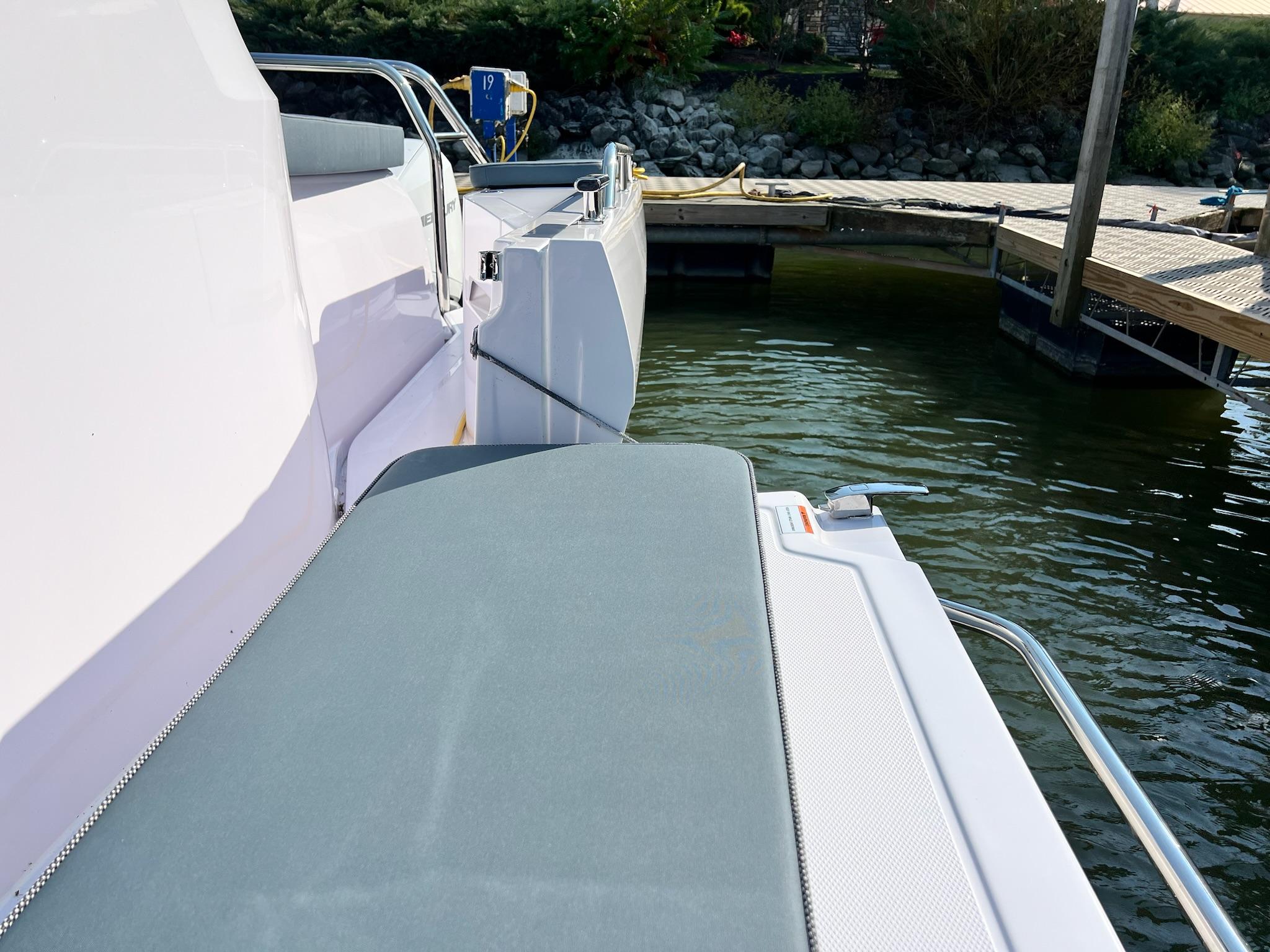 2024 Axopar 45 XC Cross Cabin boat docked by the water.