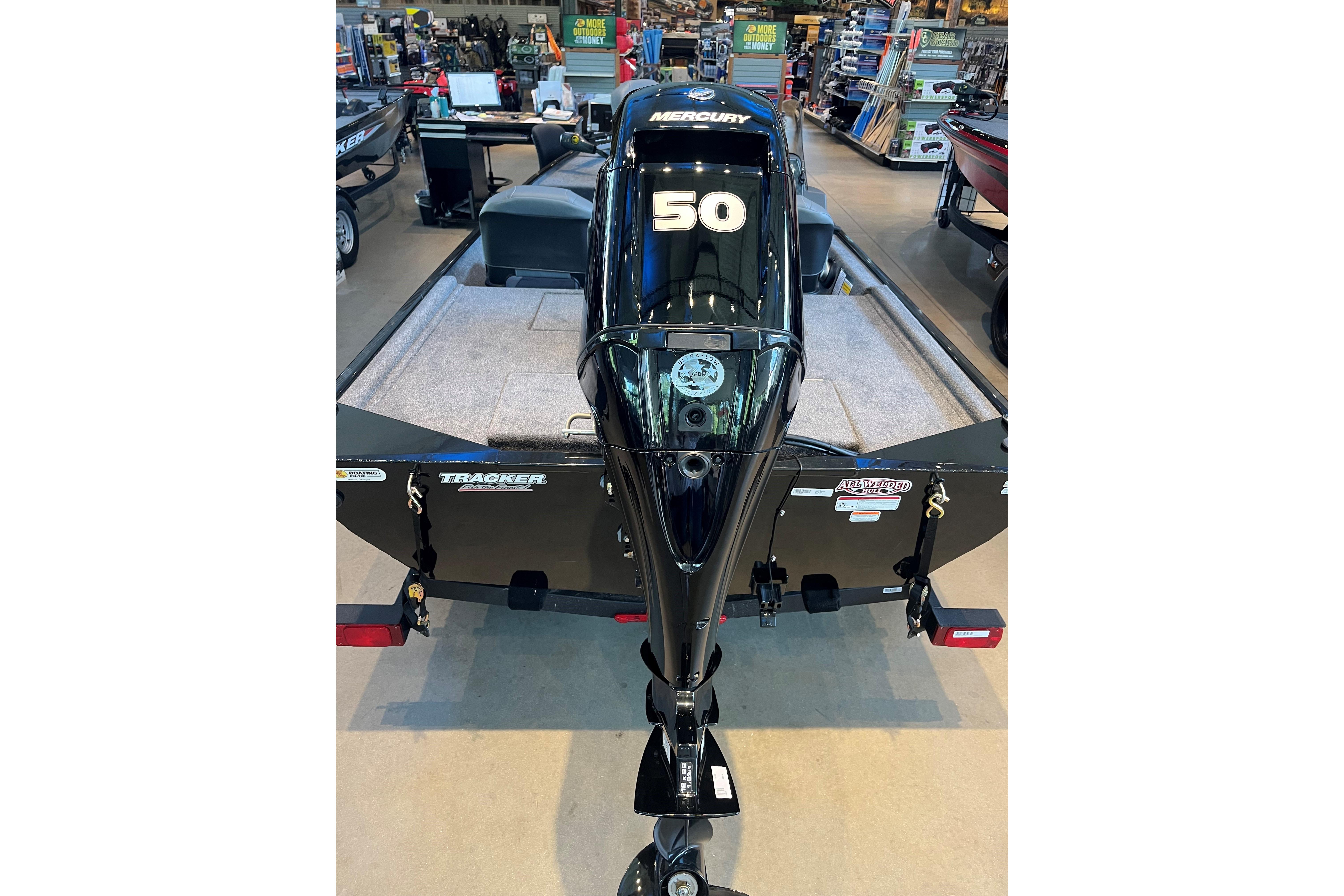 2026 Tracker Bass Tracker Classic XL boat with Mercury 50 engine in showroom.