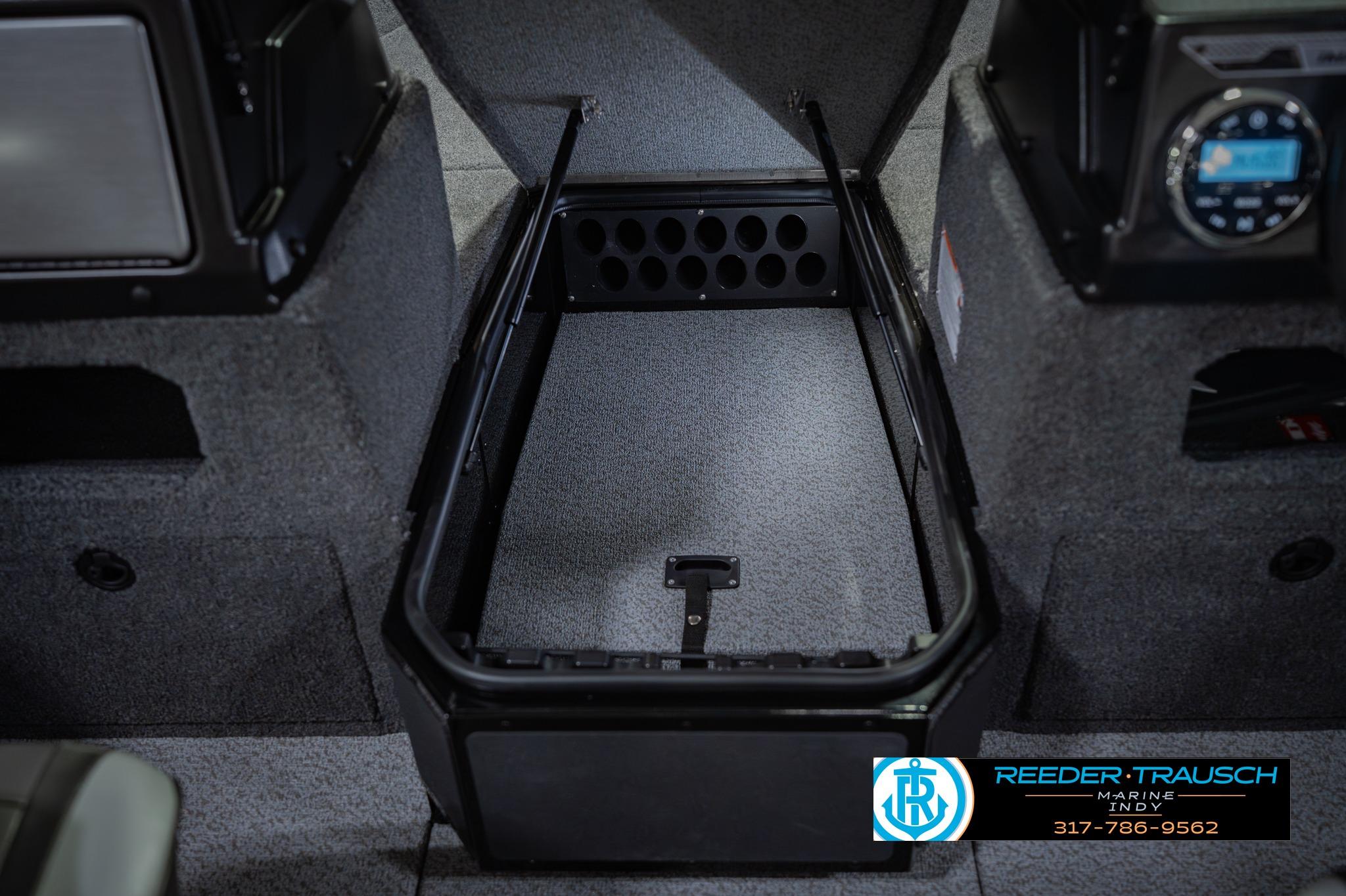 Interior storage compartment of 2026 Lund 1775 Impact XS boat, featuring carpeted finish.